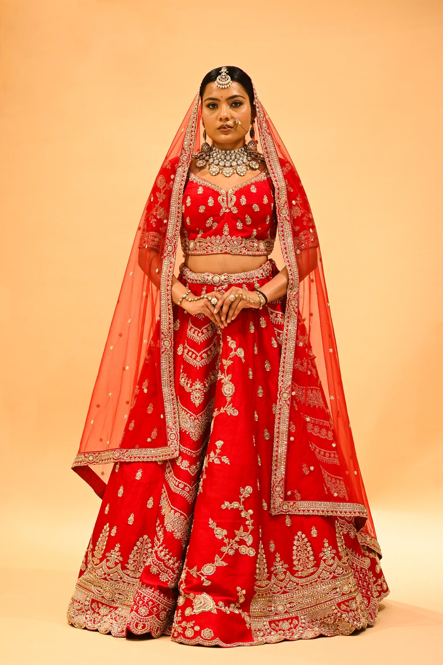 RED BRIDAL WEDDING LEHENGA WITH THREE-PANEL DESIGN, 6-METER FLAIR, DOUBLE DUPATTA, POTLI & EMBROIDERED TASSELS