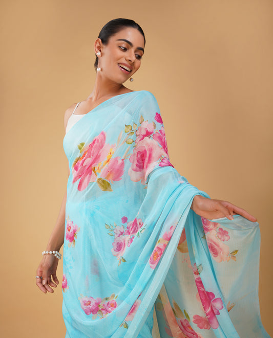 ( DELIVERY IN 15-20 DAYS ) CAPRI BLUE PRINTED CHINON SAREE WITH THIN ZARI WEAVE AND PLAIN CREPE BLOUSE