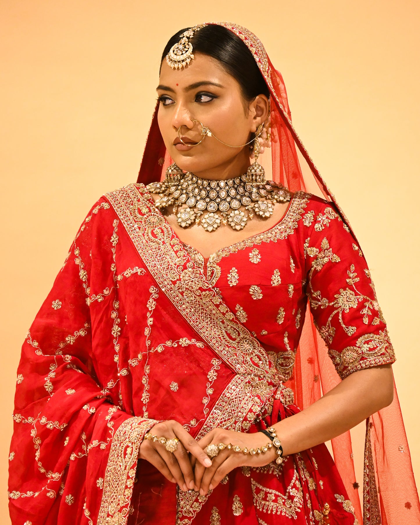 RED BRIDAL WEDDING LEHENGA WITH THREE-PANEL DESIGN, 6-METER FLAIR, DOUBLE DUPATTA, POTLI & EMBROIDERED TASSELS