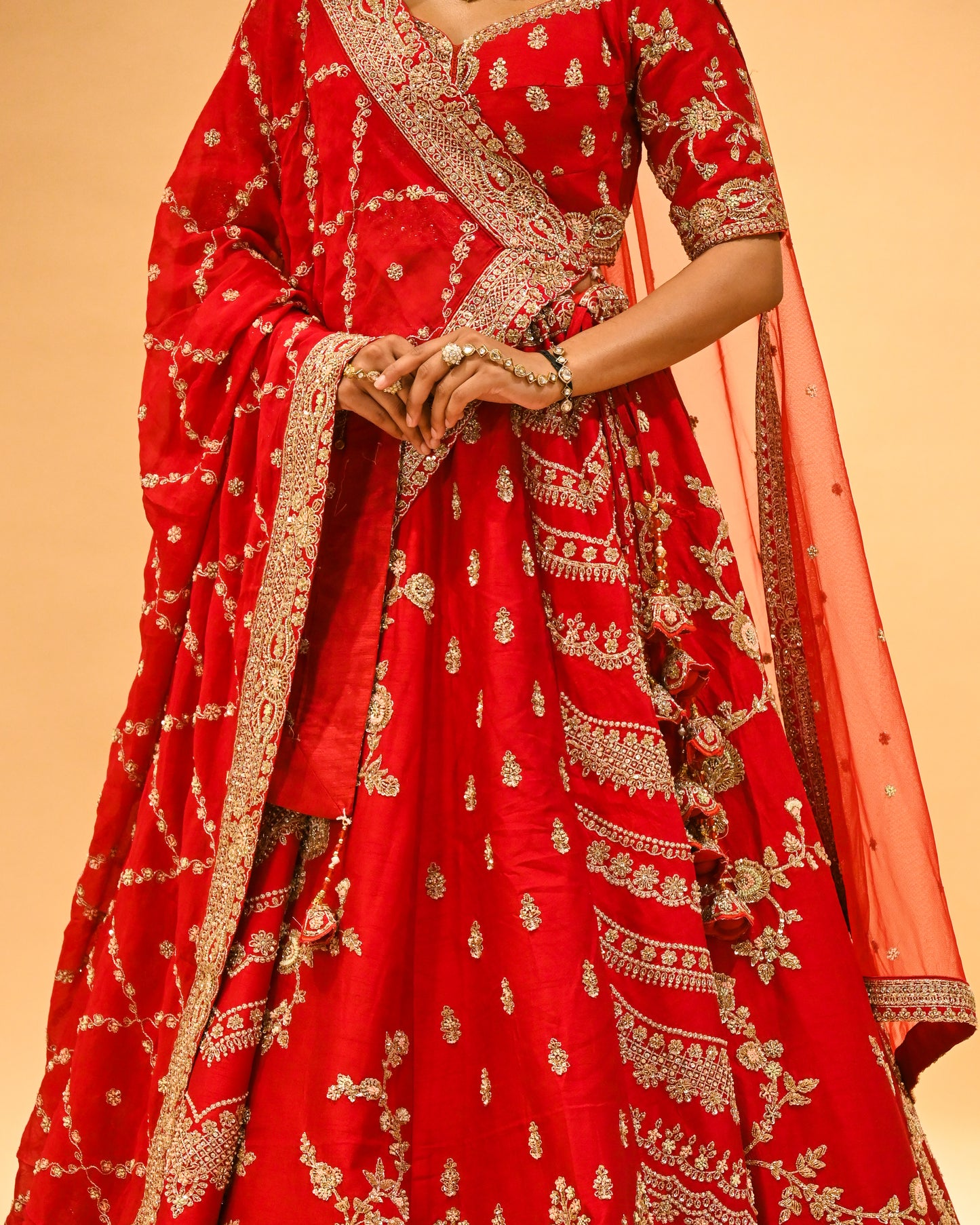 RED BRIDAL WEDDING LEHENGA WITH THREE-PANEL DESIGN, 6-METER FLAIR, DOUBLE DUPATTA, POTLI & EMBROIDERED TASSELS