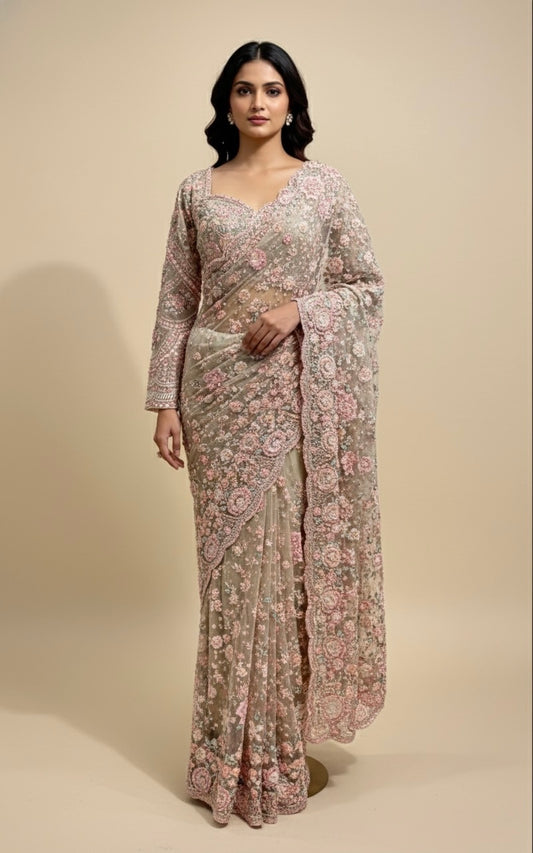 PASTEL NET EMBROIDERED SAREE WITH READYMADE BLOUSE EMBELLISHED WITH RESHAM, CUTDANA & PEARL WORK