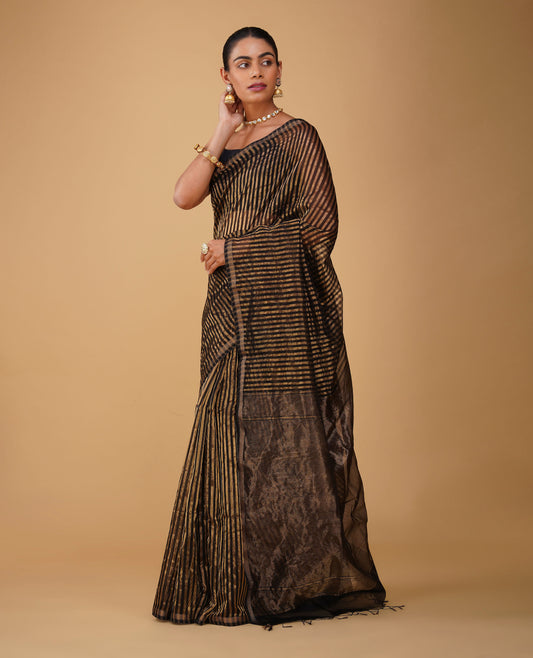 BLACK-GOLDEN VERTICAL STRIPES MAHESHWARI SAREE WITH CHATAI BORDER & PLAIN BLACK BLOUSE (DELIVERY IN 15-20 DAYS)