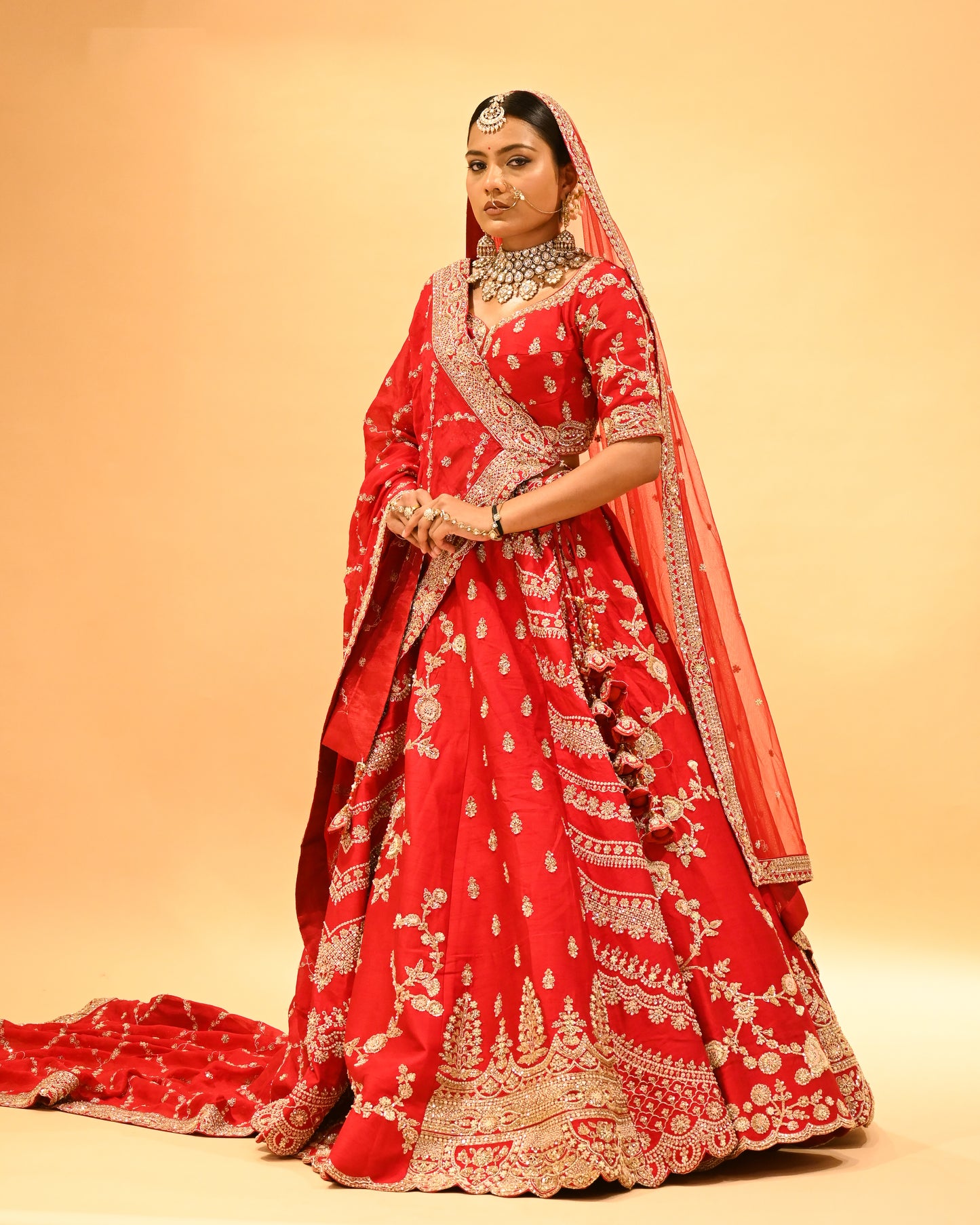 RED BRIDAL WEDDING LEHENGA WITH THREE-PANEL DESIGN, 6-METER FLAIR, DOUBLE DUPATTA, POTLI & EMBROIDERED TASSELS