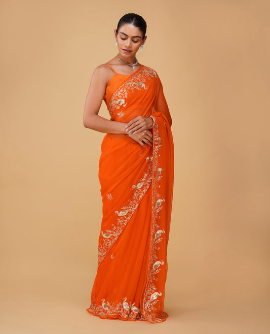 ORANGE CHIFFON SAREE WITH AARI PIPE, AND SEQUINS HAND EMBROIDERED BORDER & MOTIFS