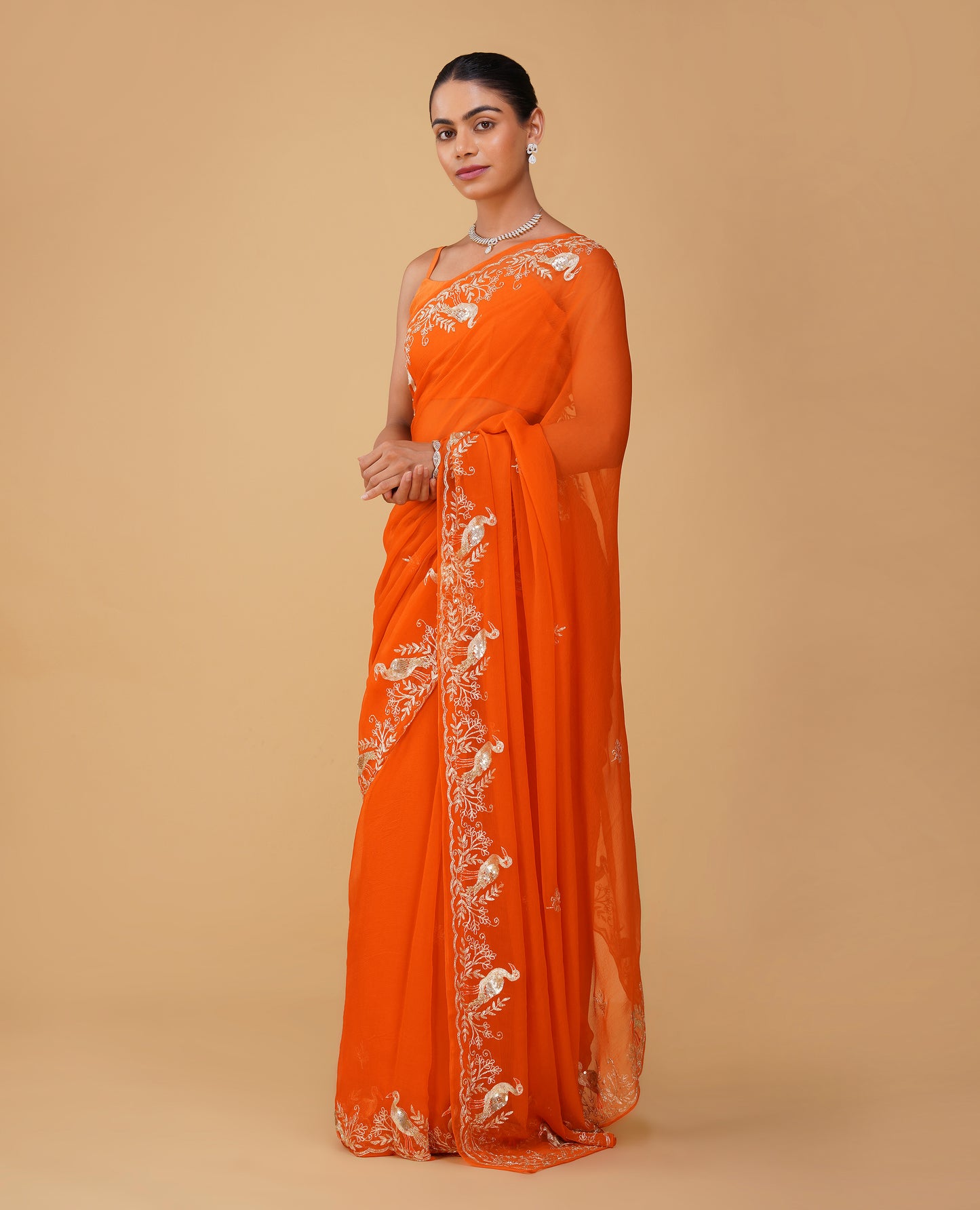 ORANGE CHIFFON SAREE WITH AARI PIPE, AND SEQUINS HAND EMBROIDERED BORDER & MOTIFS