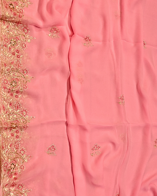 ( DELIVERY IN 20-25 DAYS ) ELECTRIC BABY PINK COLOUR ZARI AARI & RESHAM EMBROIDERED BORDER, BOOTIES IN PLANT BASED, PINK COLOUR CHIFFON SAREE