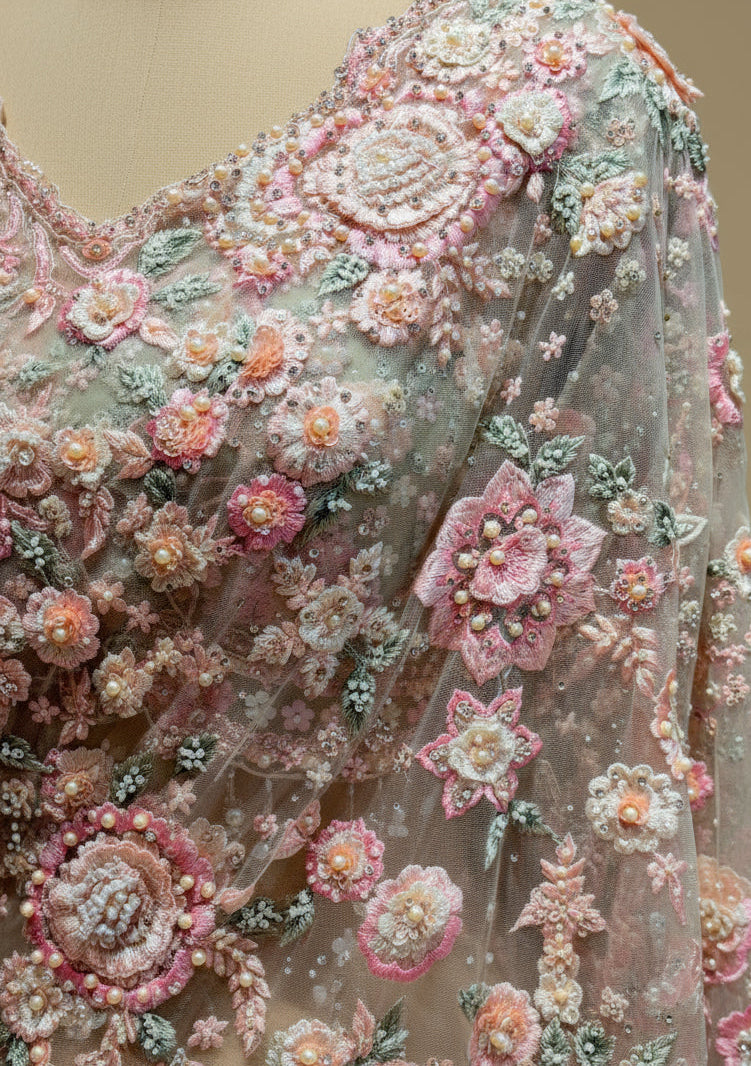 PASTEL NET EMBROIDERED SAREE WITH READYMADE BLOUSE EMBELLISHED WITH RESHAM, CUTDANA & PEARL WORK