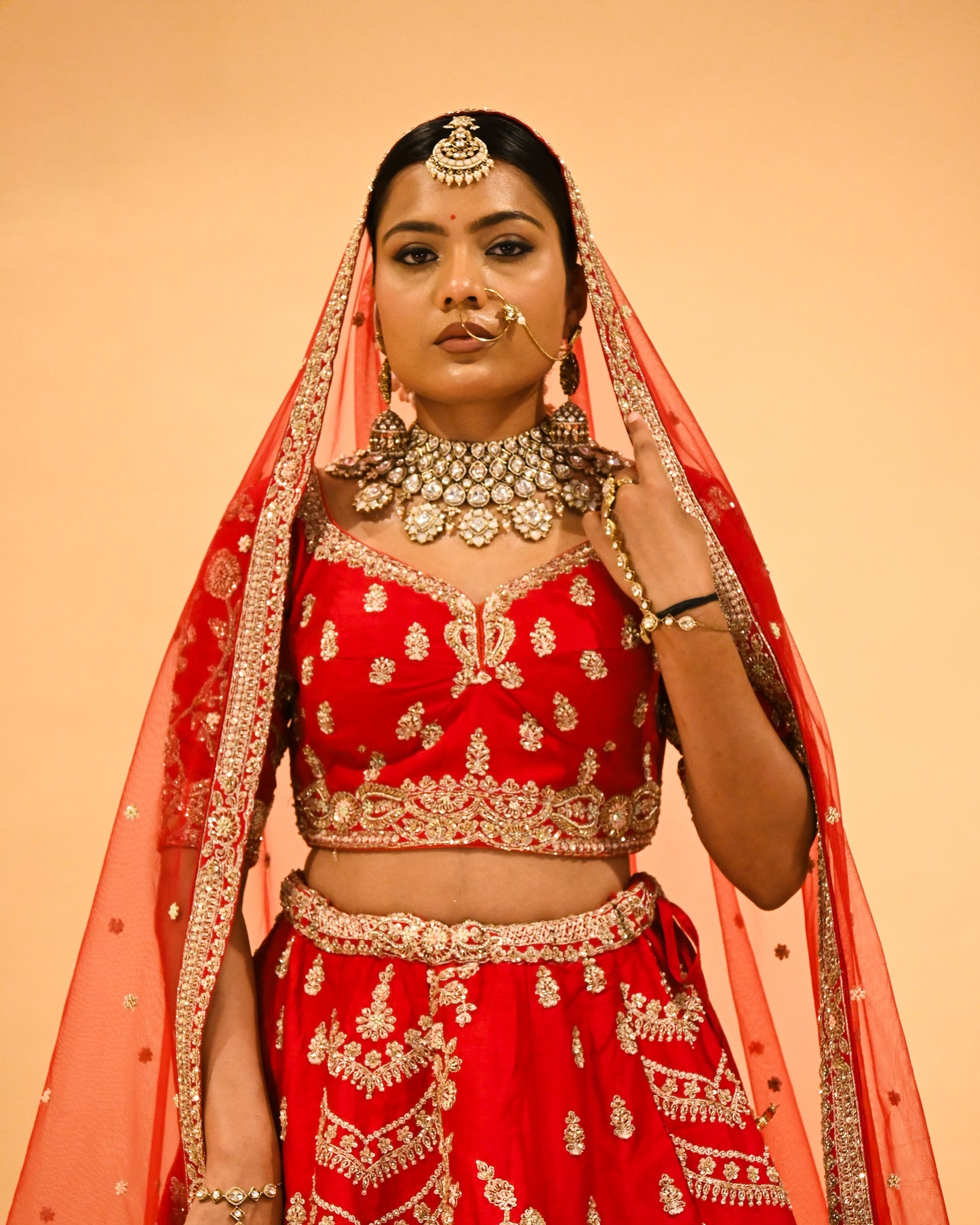 RED BRIDAL WEDDING LEHENGA WITH THREE-PANEL DESIGN, 6-METER FLAIR, DOUBLE DUPATTA, POTLI & EMBROIDERED TASSELS