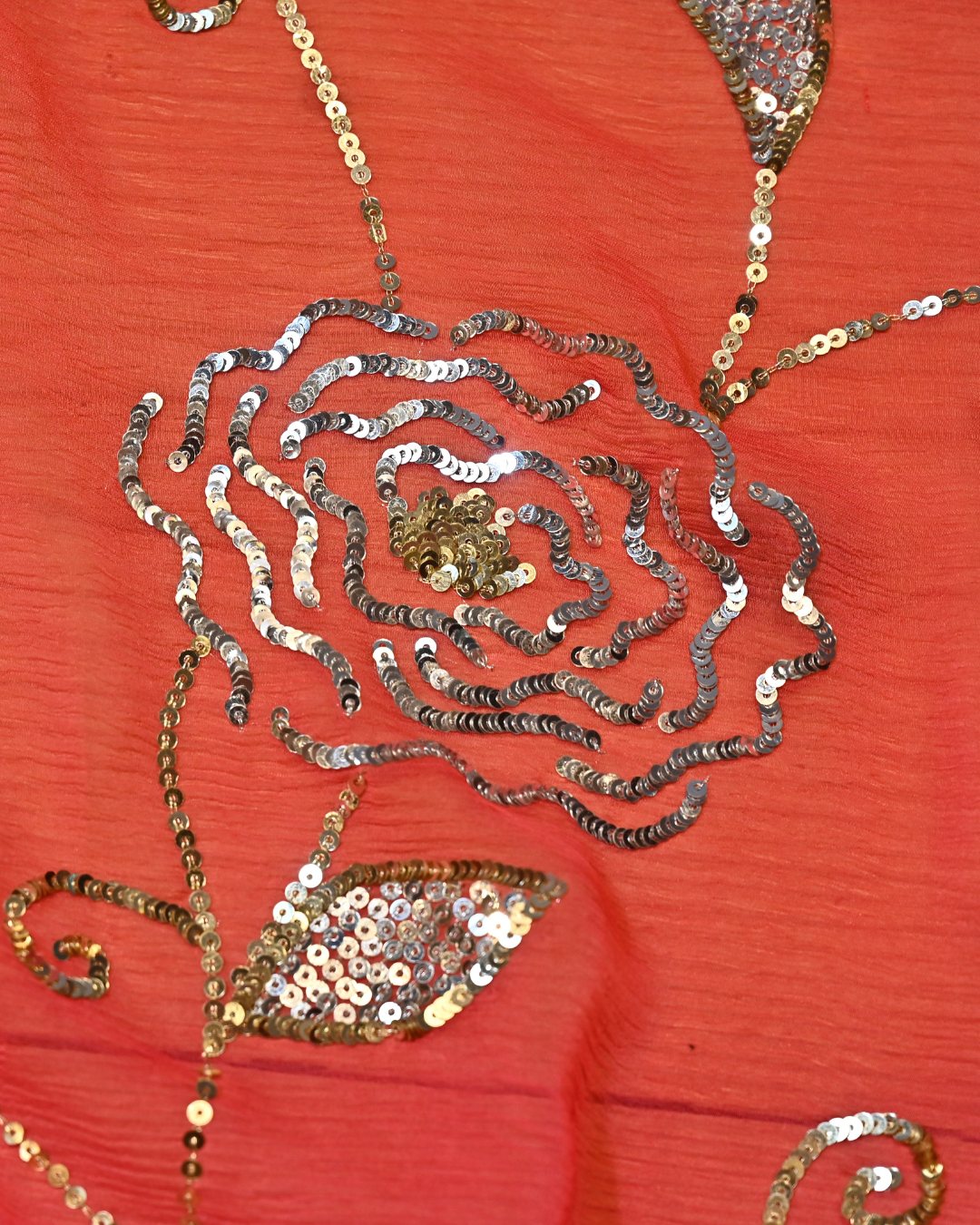 CORAL PINK COLOUR SAREE FEATURING SILVER-GOLDEN SEQUIN JAAL WITH AARI JAALI WORK