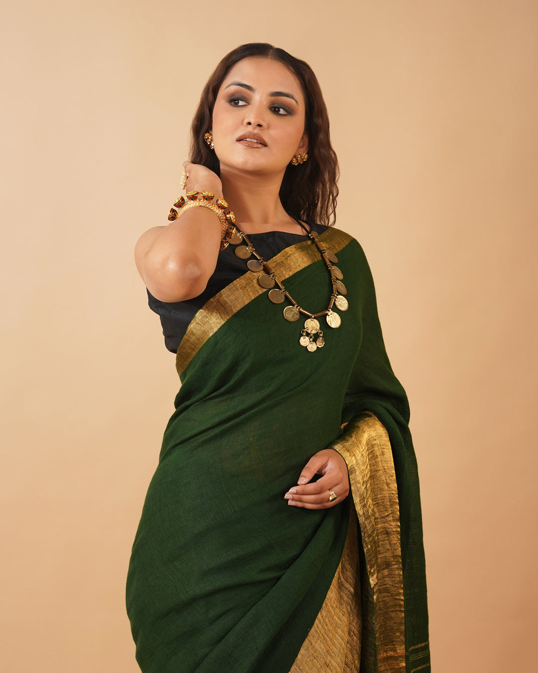 BOTTLE GREEN HANDWOVEN LINEN SAREE WITH GOLDEN DRILL WEAVE SKIRT BORDER