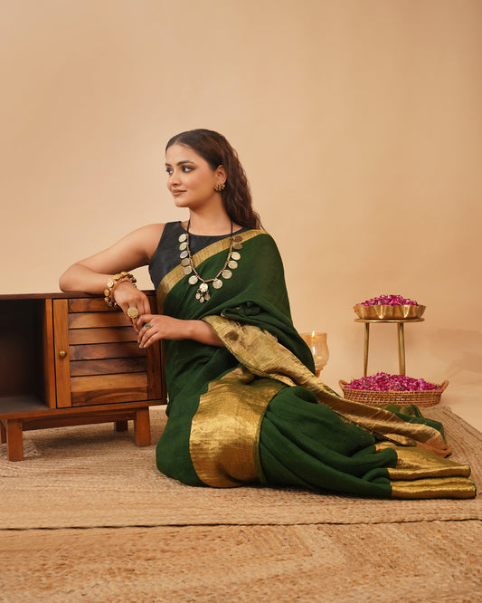 BOTTLE GREEN HANDWOVEN LINEN SAREE WITH GOLDEN DRILL WEAVE SKIRT BORDER