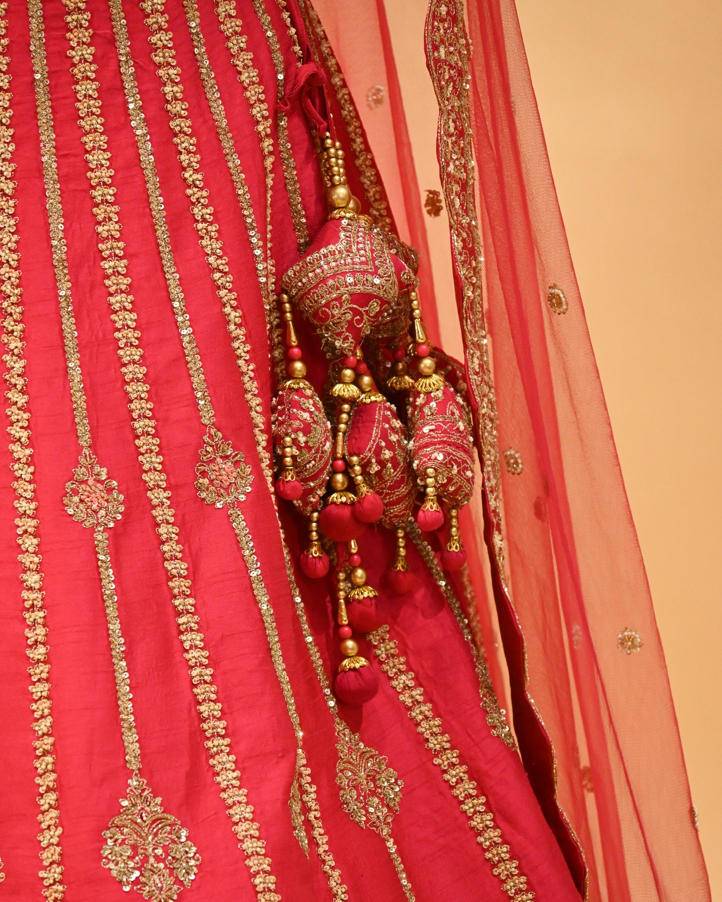 RANI HAND-EMBROIDERED BRIDAL LEHENGA WITH READYMADE BLOUSE, NET DUPATTA & EMBROIDERED TASSELS
