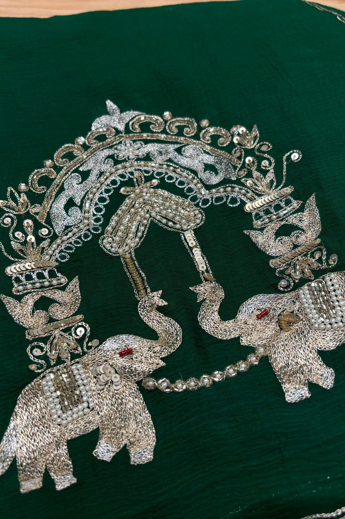 BOTTLE GREEN CHIFFON SAREE WITH INTRICATE AARI ZARDOZI EMBROIDERED ELEPHANT TEMPLE MOTIFS