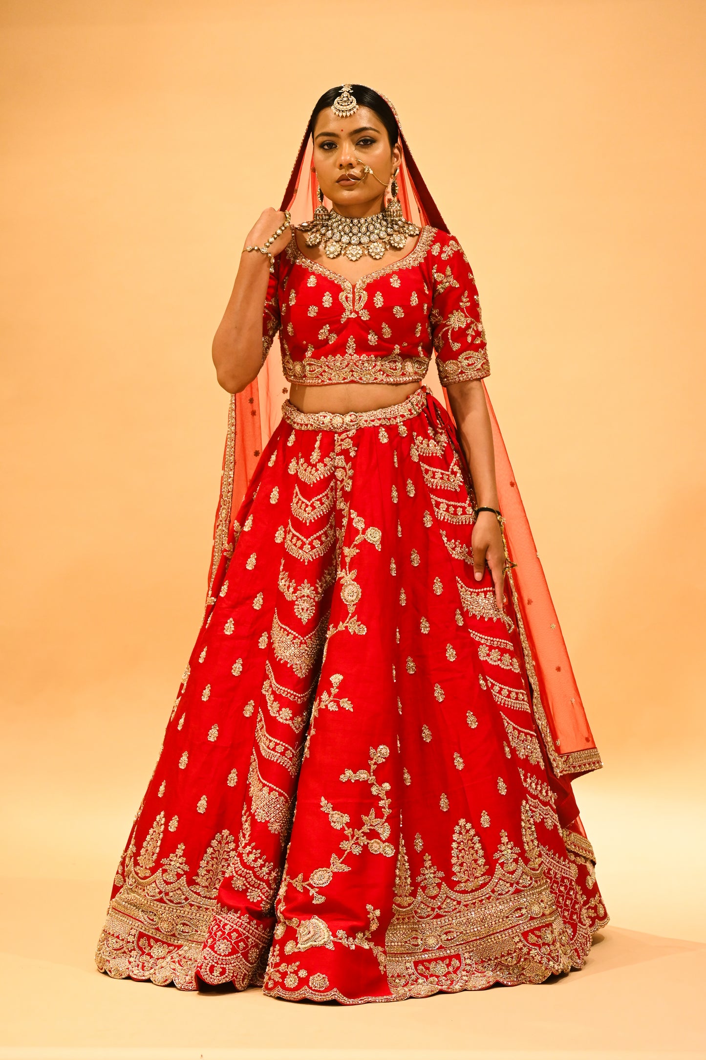 RED BRIDAL WEDDING LEHENGA WITH THREE-PANEL DESIGN, 6-METER FLAIR, DOUBLE DUPATTA, POTLI & EMBROIDERED TASSELS