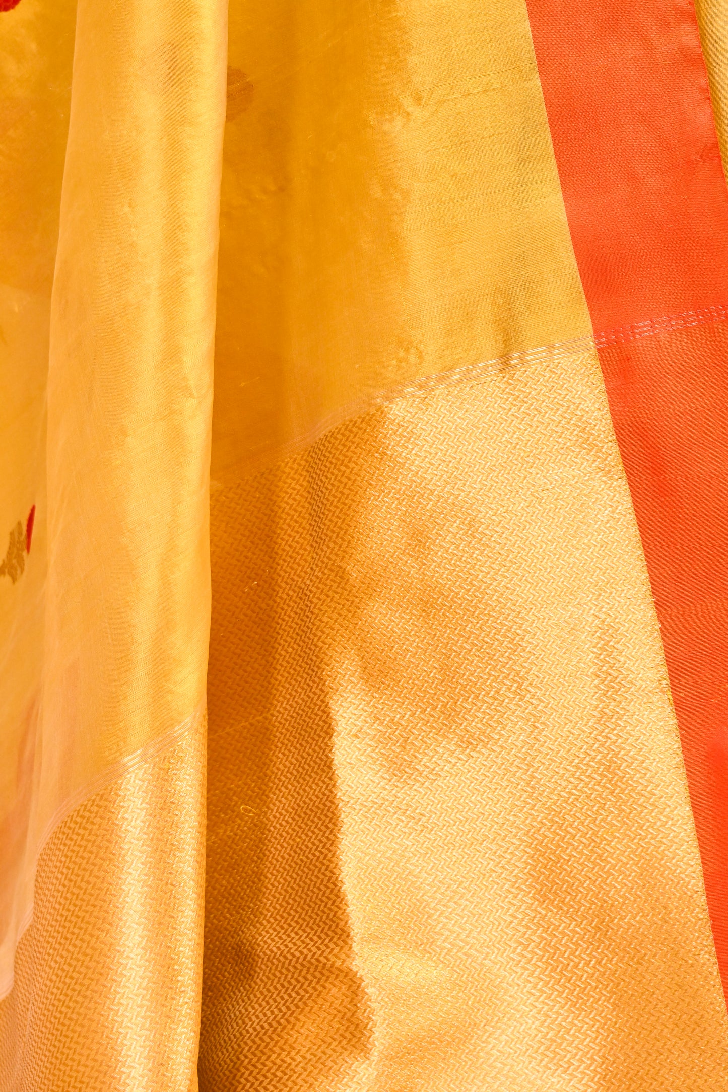 YELLOW CHANDERI HANDWOVEN SILK SAREE WITH CONTRAST ORANGE BORDER AND ZARI PALLA