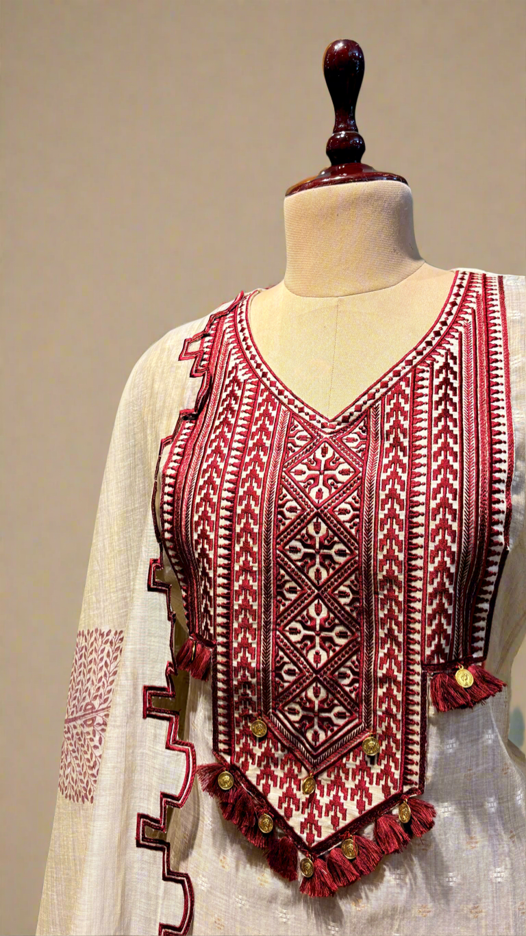 BEIGE JAMDANI DHAKAI COTTON UNSTITCHED SUIT EMBELLISHED WITH RED RESHAM EMBROIDERY, TASSELS ON KURTA & SCALLOP BORDER PRINTED DUPATTA