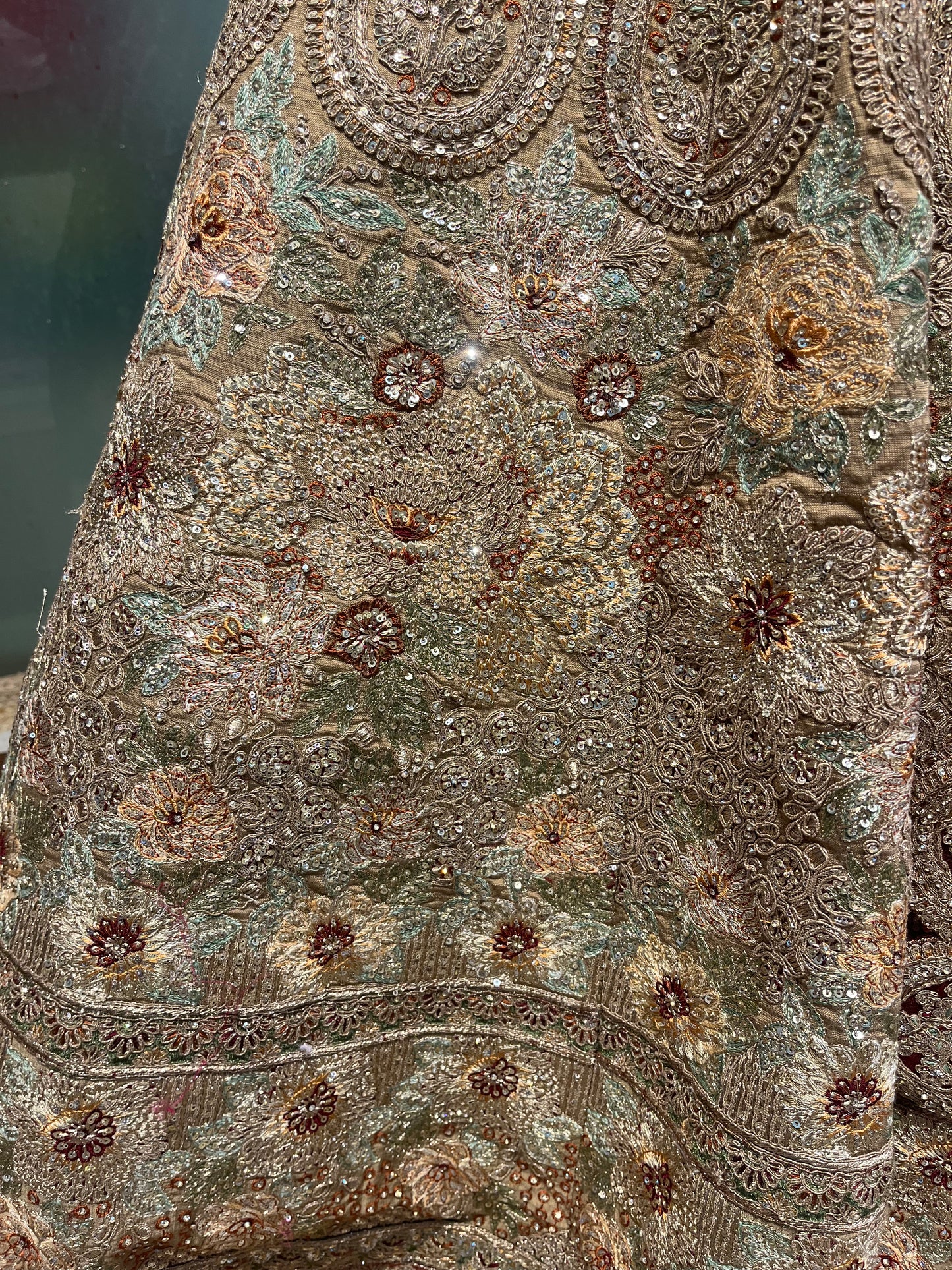 GOLDEN MATTE FINISH ZARI LEHENGA WITH READYMADE BLOUSE AND RED CONTRAST SCALLOPED BORDER DUPATTA, PAIRED WITH AN EXTRA RED DUPATTA