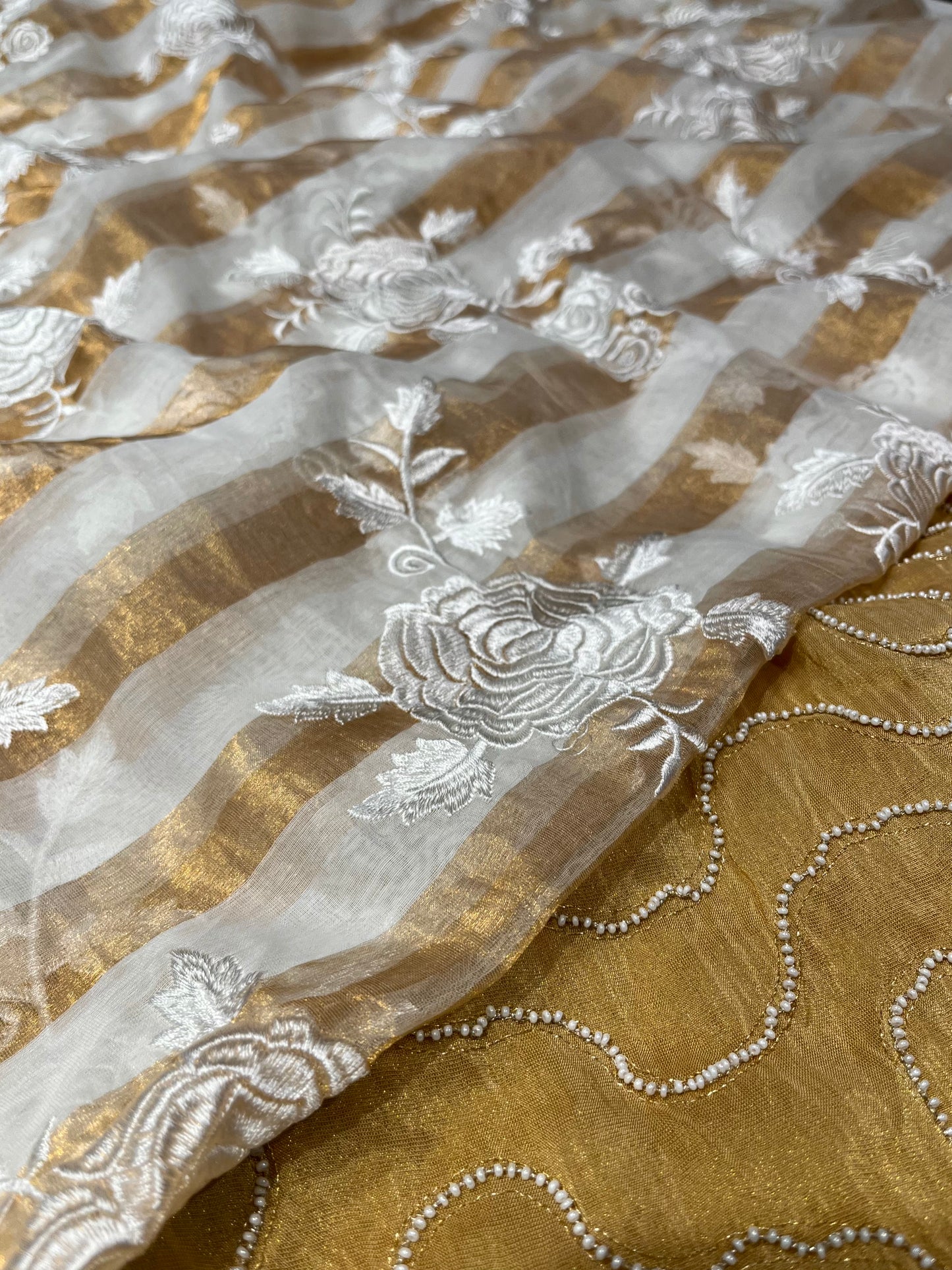 IVORY COLOUR CHANDERI GOLDEN STRIPED PARSI EMBROIDERED SAREE PAIRED WITH AN UNSTITCHED GOLDEN BLOUSE BY SIDDHAIKA