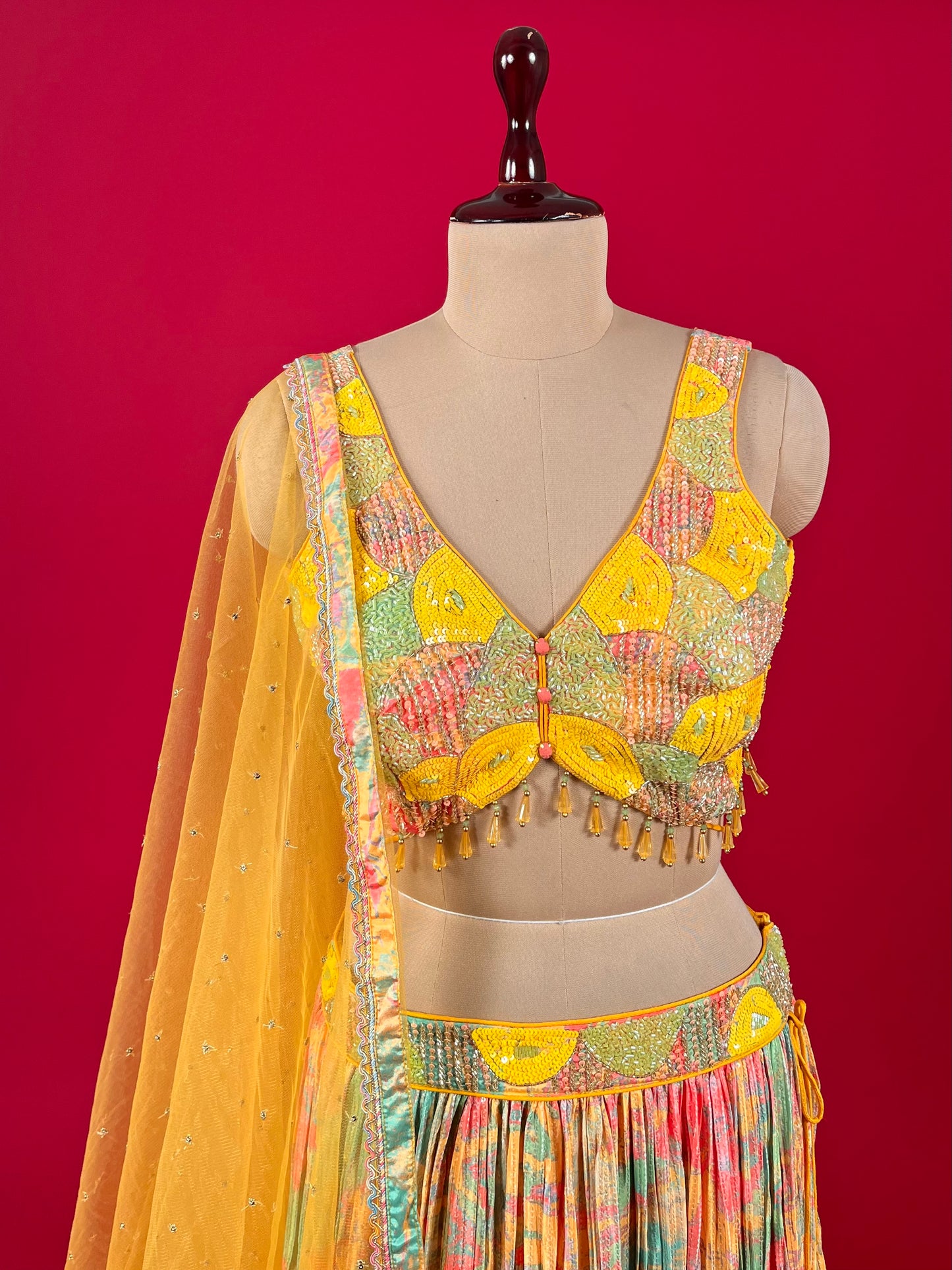 MULTI COLOUR CREPE SILK SEQUINS SKIRT WITH EMBROIDERED BLOUSE & NET DUPATTA EMBELLISHED WITH CUTDANA & SEQUINS WORK