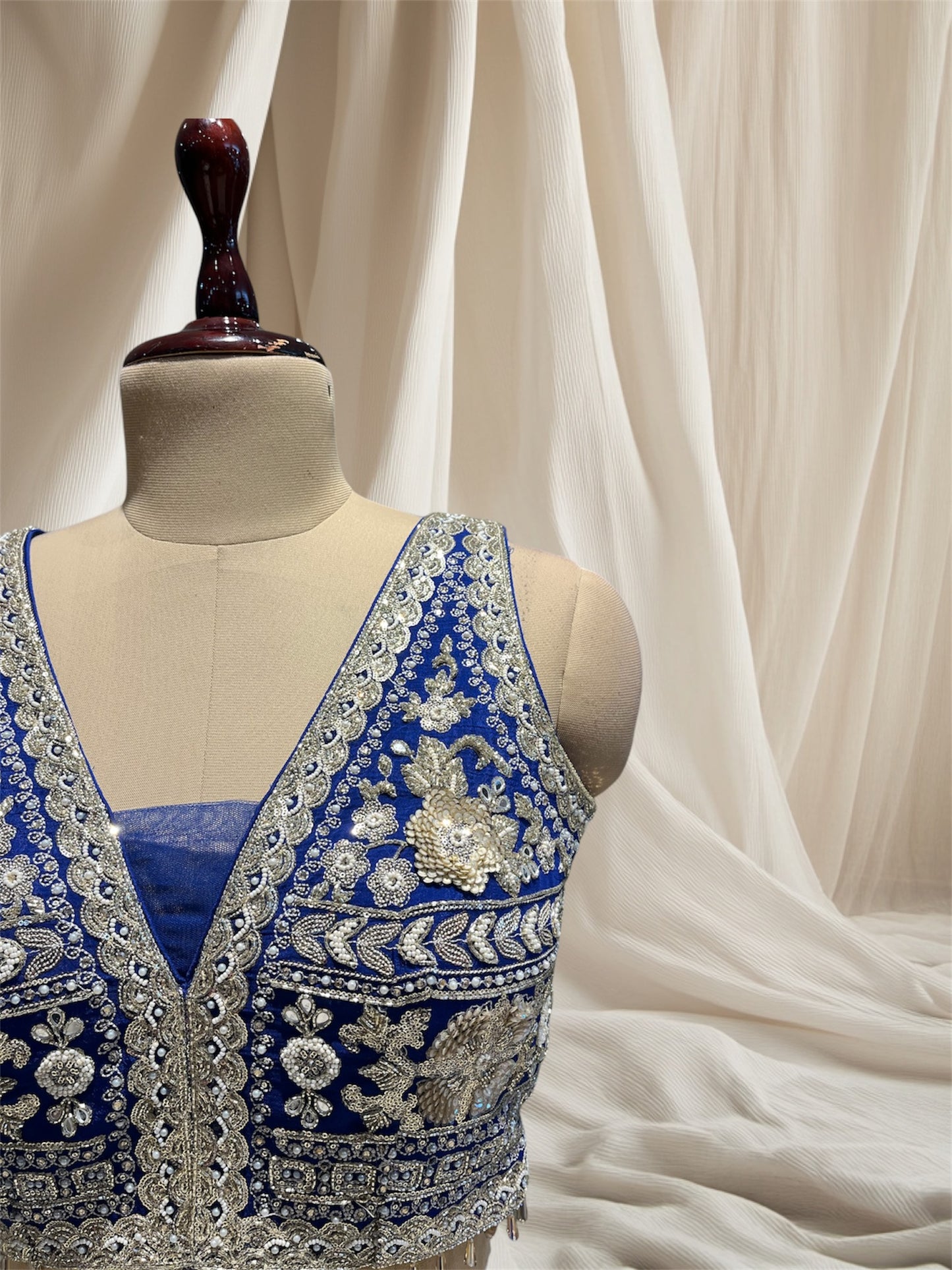 ( DELIVERY IN 50 DAYS ) ROYAL BLUE COLOUR CRUSH SILK LEHENGA WITH APPLIQUE WORK PAIRED WITH OFFWHITE NET APPLIQUE WORK DUPATTA & SEQUENCE, BEADS EMBROIDERY BLOUSE