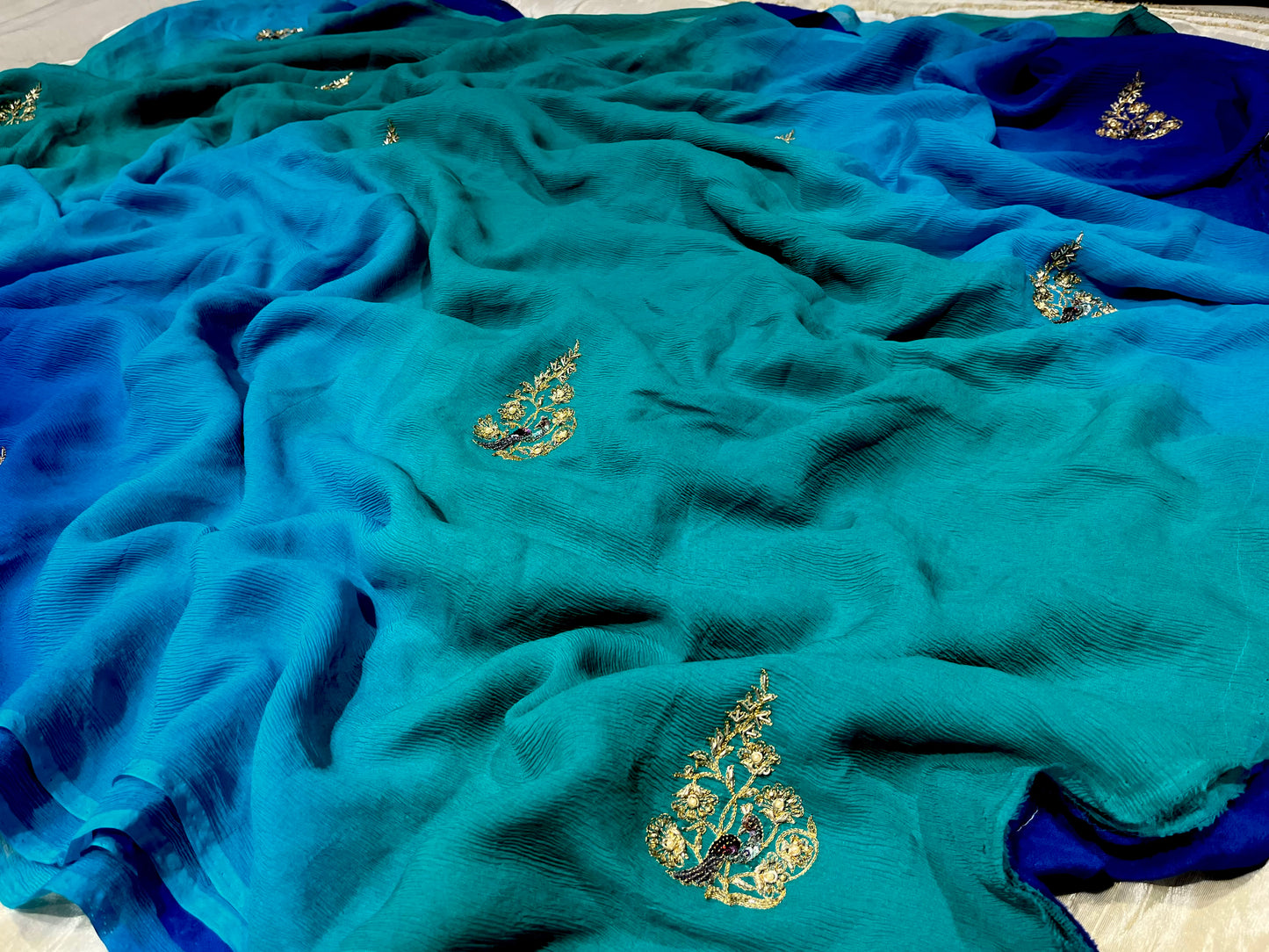 ( DELIVERY IN 25 DAYS ) BLUE SHADED PURE CHIFFON HAND EMBROIDERED SAREE EMBELLISHED WITH ZARDOZI WORK