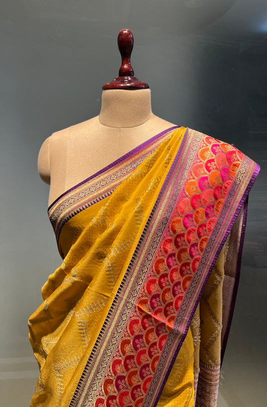 MUSTARD COLOUR GEORGETTE TISSUE SAREE EMBELLISHED WITH ZARI WEAVES