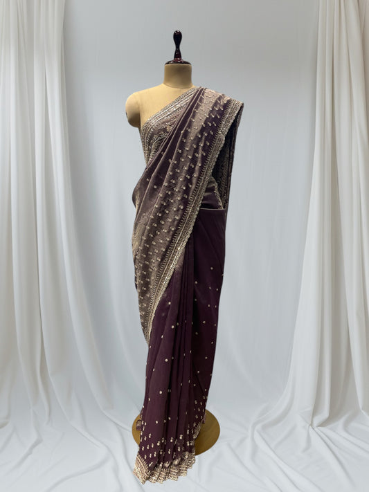 DUSTY WINE COLOR, GEOGETTE TISSUE SAREE WITH SEQUINS, PEARL & CUTDANA EMBROIDERY, PAISLEY MOTIFS ARE PLACED ON SHOULDER AND PALLA.