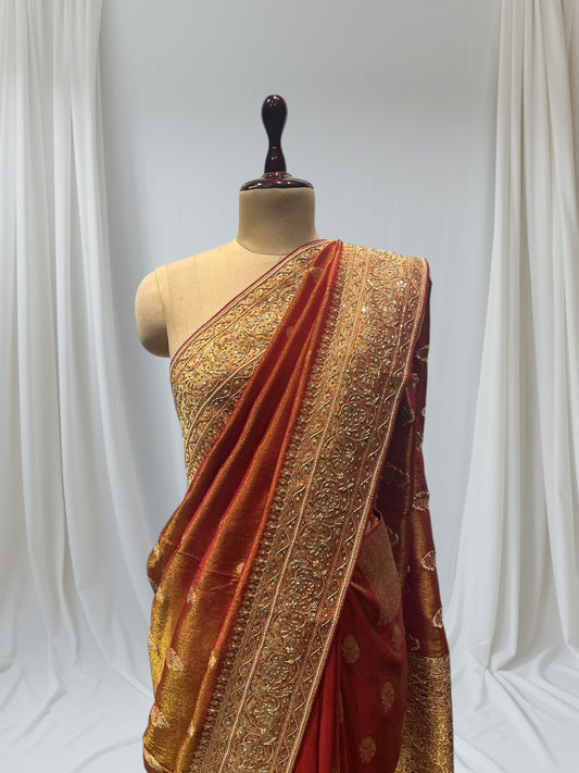 RUST COLOR BANARASI SAREE EMBELLISHED WITH ZARDOZI EMBROIDERY, SEQUINS & PEARL WORK