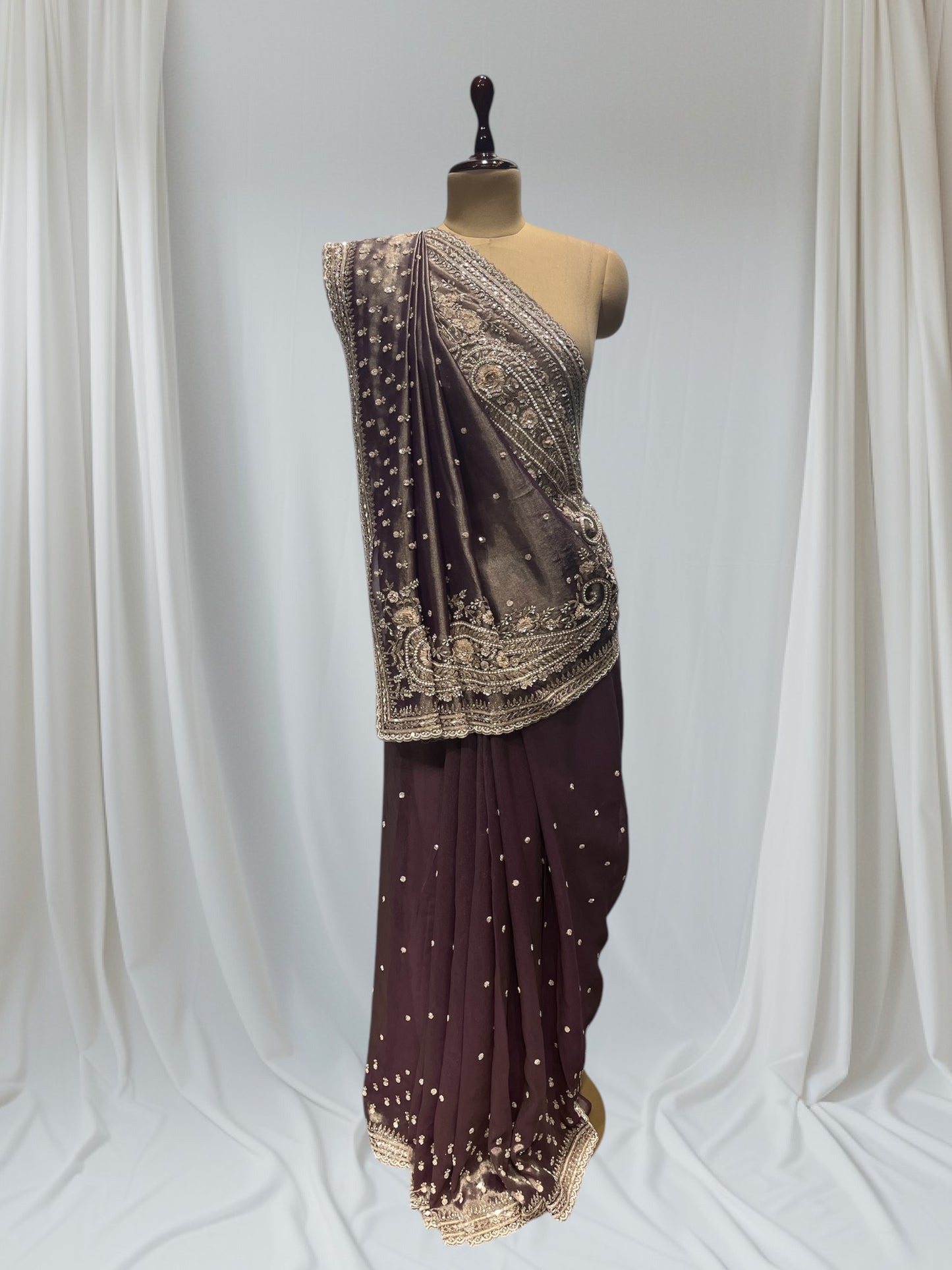 DUSTY WINE COLOR, GEOGETTE TISSUE SAREE WITH SEQUINS, PEARL & CUTDANA EMBROIDERY, PAISLEY MOTIFS ARE PLACED ON SHOULDER AND PALLA.