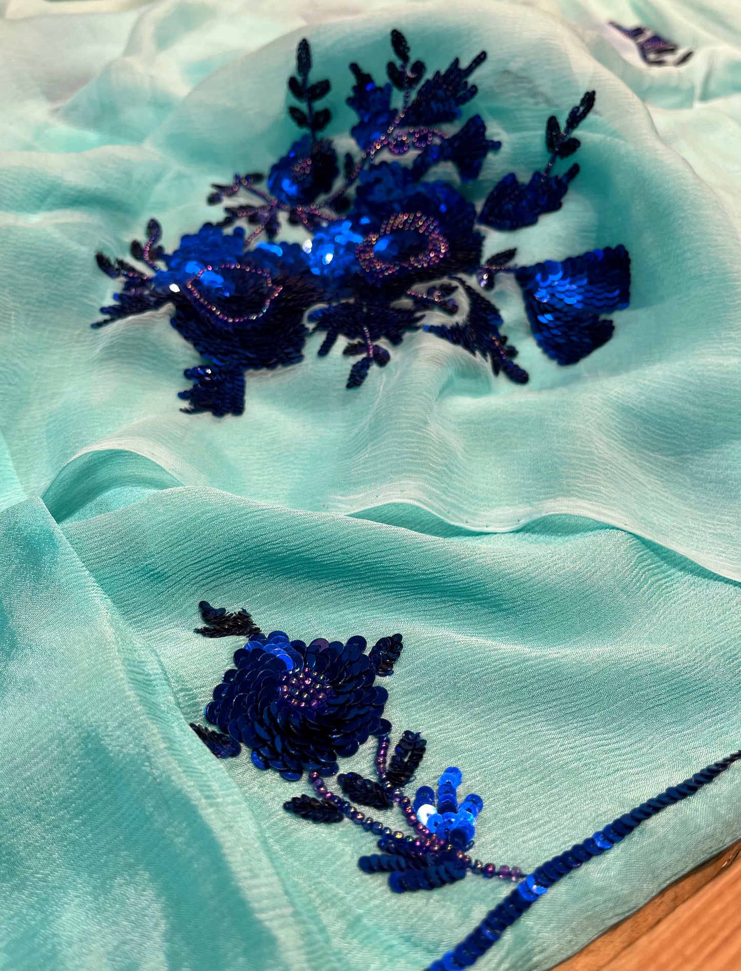 ( DELIVERY IN 20-25 DAYS ) AQUA COLOUR CHIFFON HAND EMBROIDERED SAREE EMBELLISHED WITH SEQUINS WORK