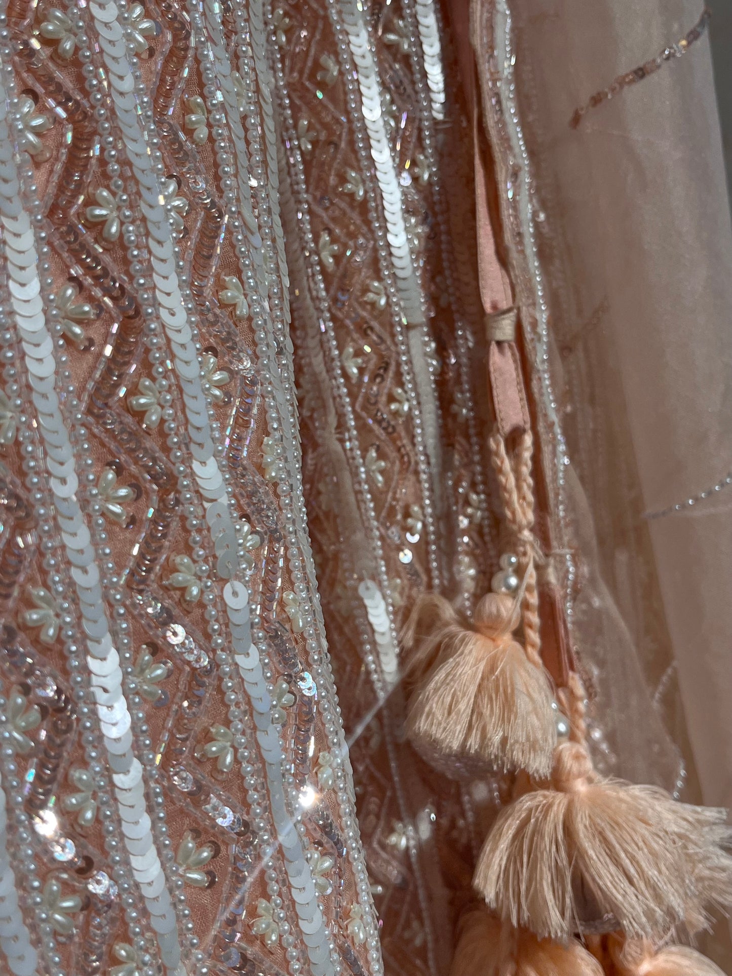 PEACH COLOUR ORGANZA HAND EMBROIDERED LEHENGA EMBELLISHED WITH SEQUINS, CUTDANA WORK & UNSTITCHED BLOUSE