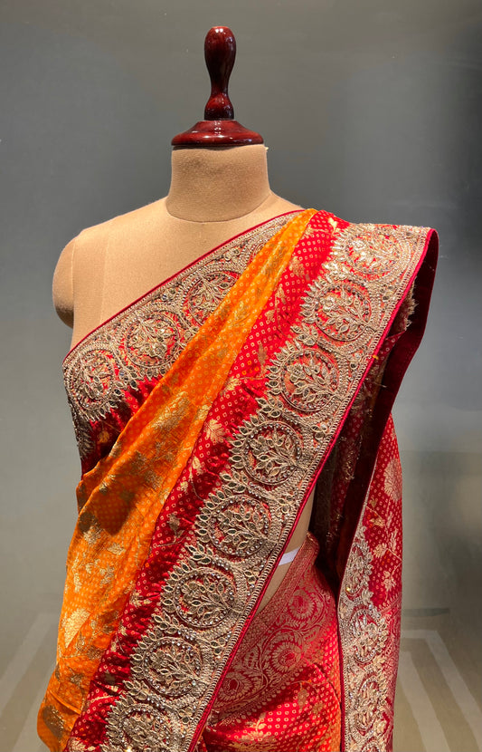 ( DELIVERY IN 25 DAYS ) YELLOW & RED SHADED BANDHANI DOLA SILK EMBROIDERED SAREE EMBELLISHED WITH GOTA PATTI & STONE WORK