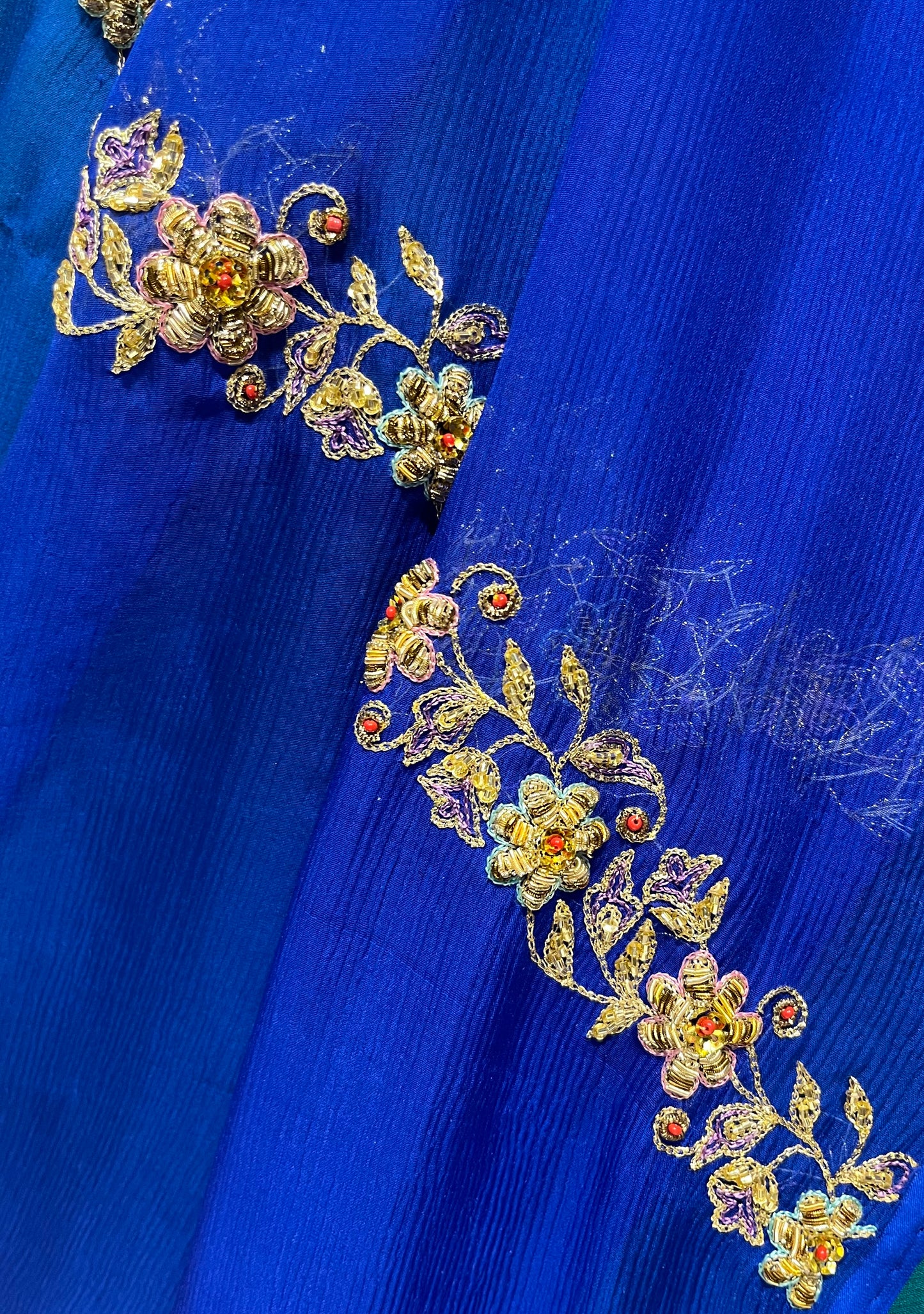 GREEN & BLUE PURE CHIFFON HAND EMBROIDERED SAREE EMBELLISHED WITH ZARDOZI, CUTDANA & AARI WORK - Kothari Sons