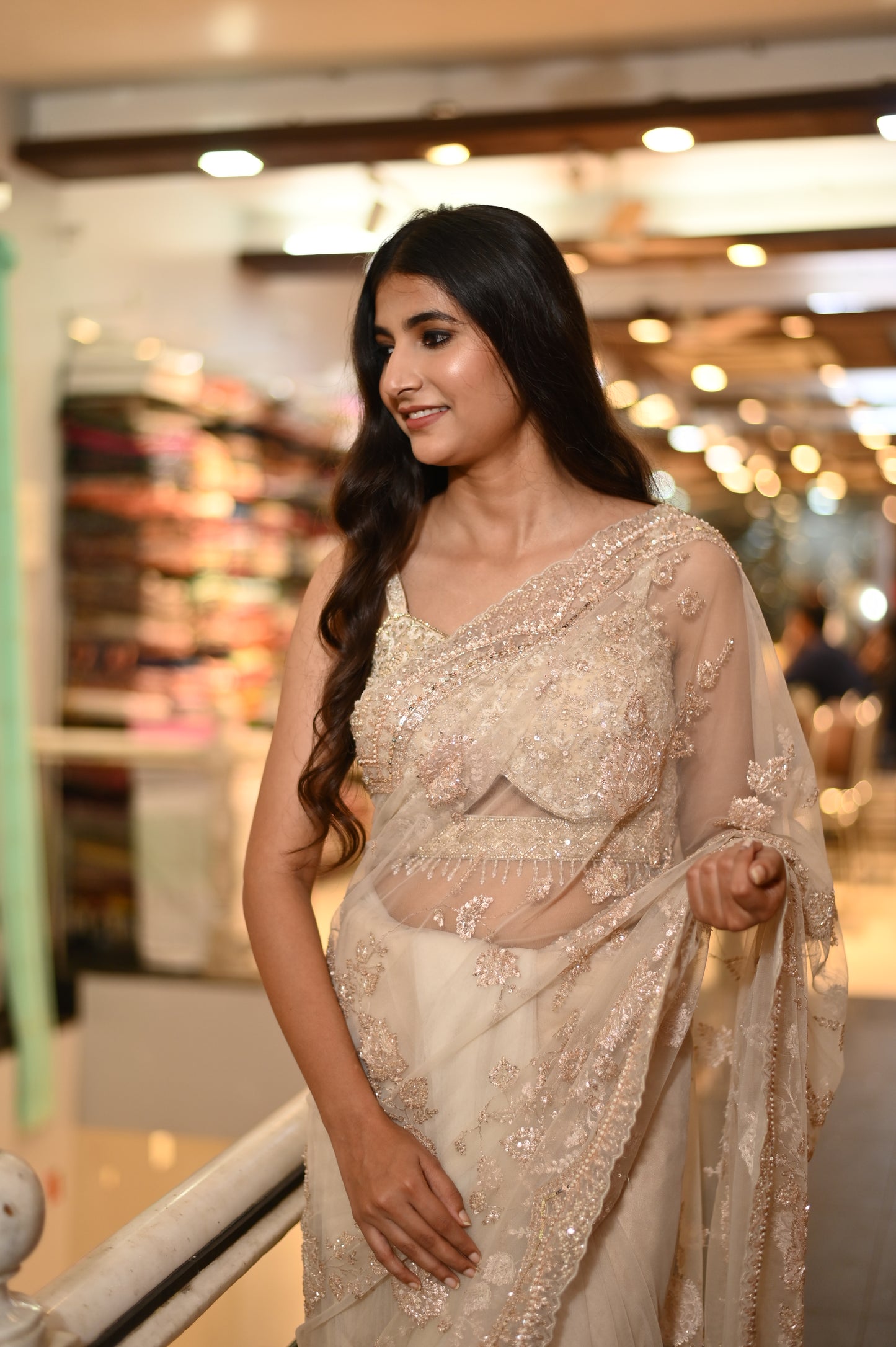 ( DELIVERY IN 25 DAYS ) BEIGE COLOUR NET HAND EMBROIDERED SAREE EMBELLISHED WITH ZARI, SEQUENCE & CUTDANA WORK