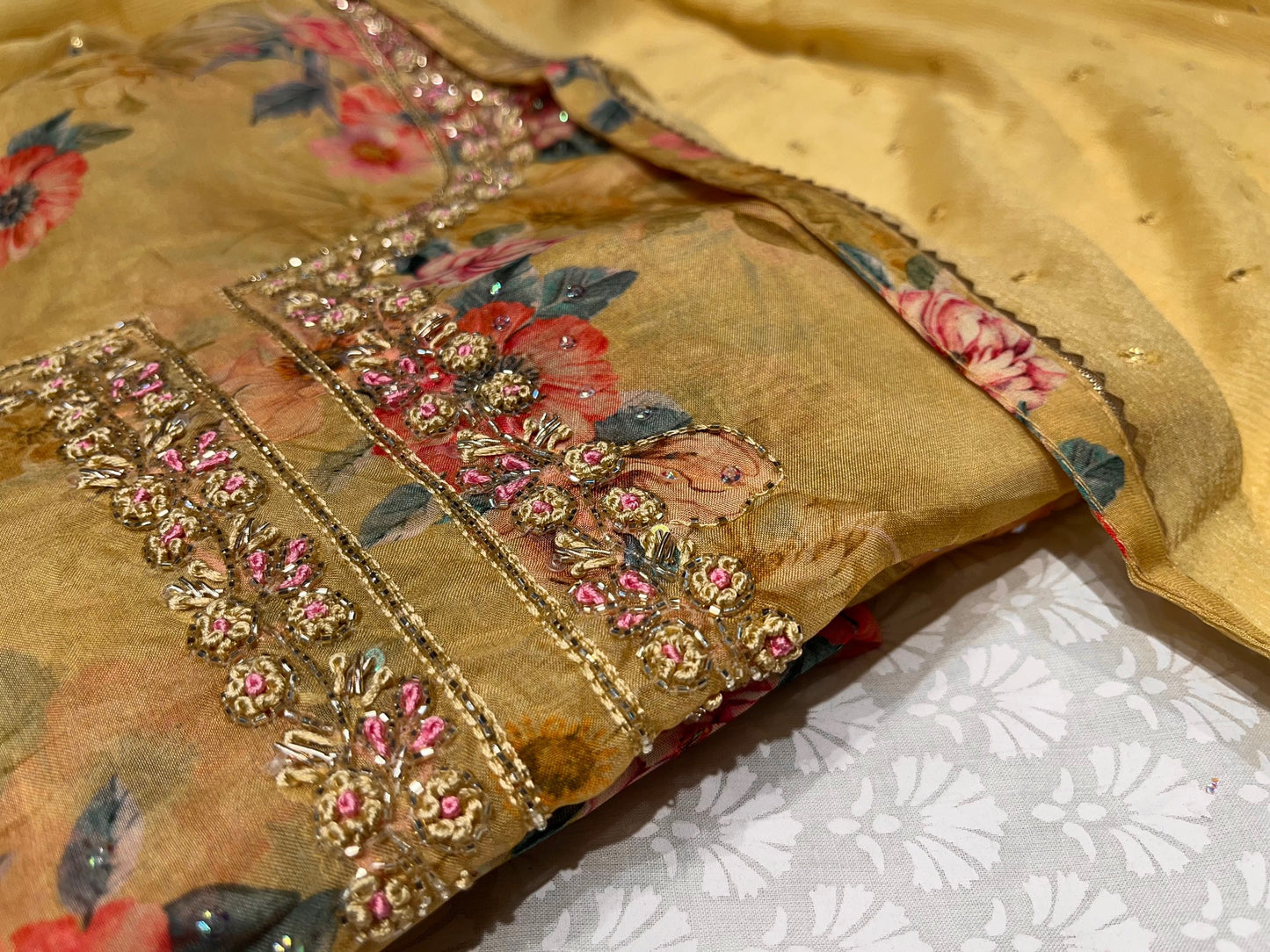 BEIGE YELLOW COLOUR ORGANZA UNSTITCHED SUIT WITH CHIFFON DUPATTA EMBELLISHED WITH CUTDANA WORK