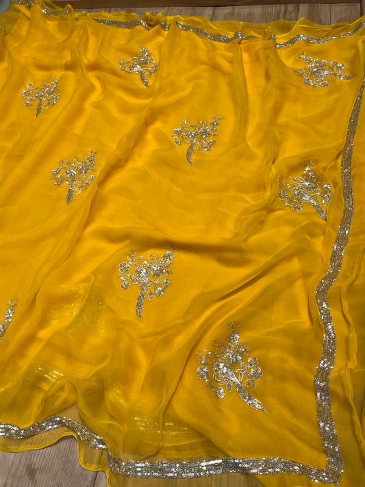 ( DELIVERY IN 20-25 DAYS ) YELLOW CHIFFON HAND EMBROIDERED SAREE EMBELLISHED WITH SEQUINS & CUTDANA WORK