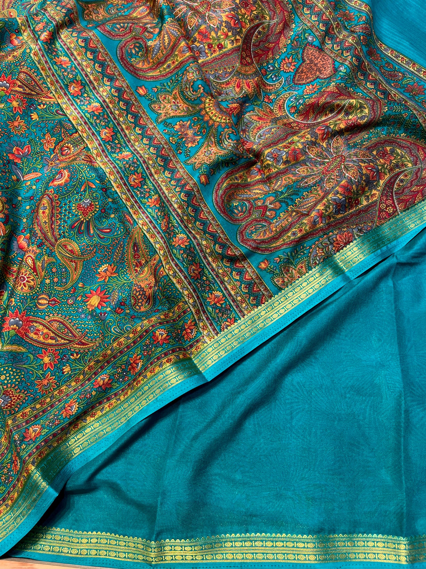 TEAL COLOUR ART CREPE SILK PRINTED SAREE WITH ZARI BORDER (DELIVERY TIME 15 DAYS)