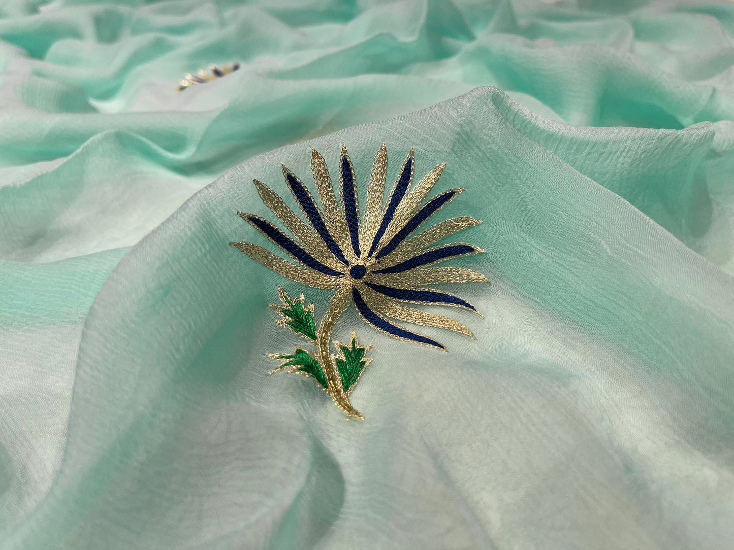 (DELIVERY IN 25 DAYS) AQUA COLOUR CHIFFON EMBROIDERED SAREE EMBELLISHED WITH AARI WORK