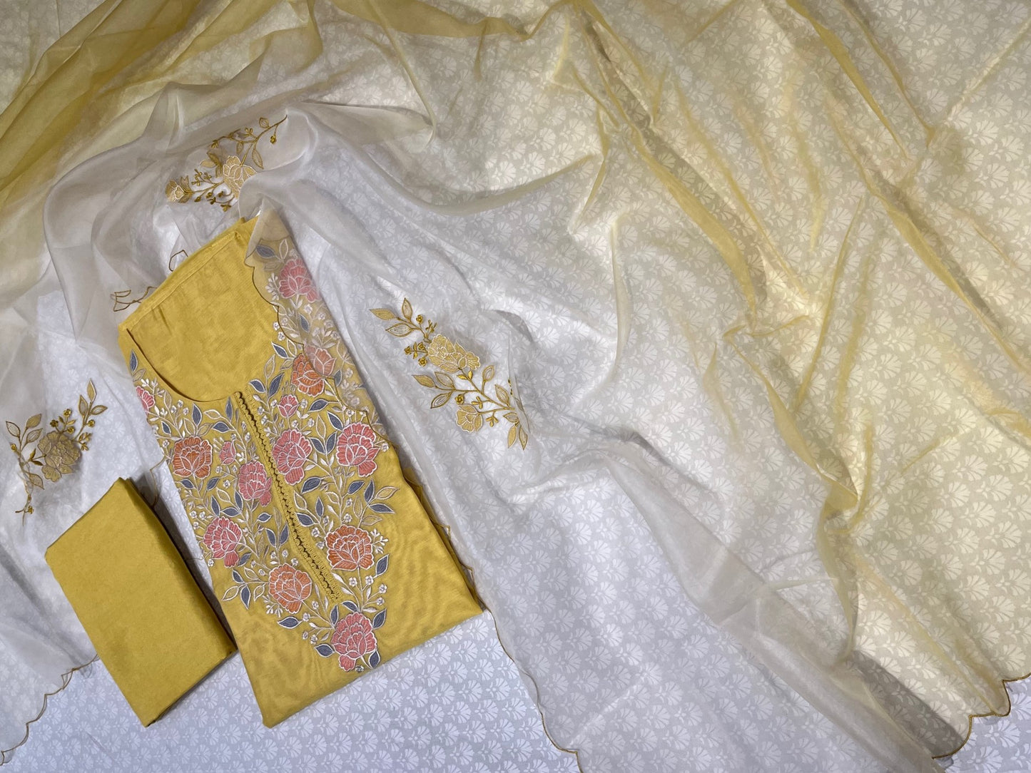 (DELIVERY IN 25 DAYS) YELLOW COLOUR CHANDERI EMBROIDERED UNSTITCHED SUIT WITH ORGANZA SHADED DUPATTA EMBELLISHED WITH RESHAM EMBROIDERY
