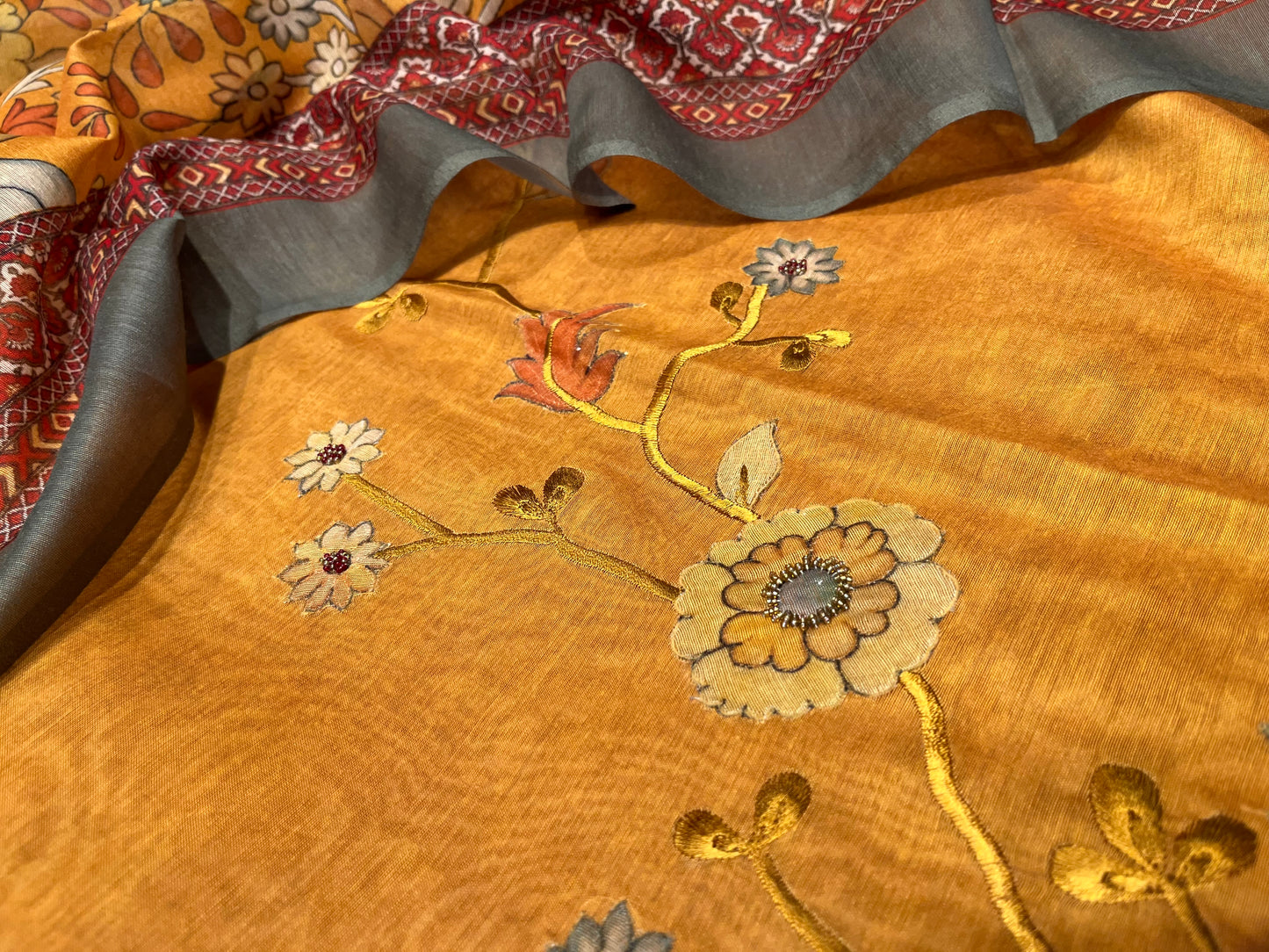 MUSTARD COLOUR CHANDERI UNSTITCHED SUIT WITH PRINTED DUPATTA EMBELLISHED WITH RESHAM EMBROIDERY