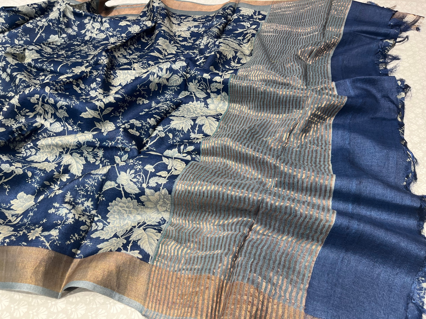 (DELIVERY IN 25 DAYS) BLUE COLOUR TUSSAR SILK PRINTED SAREE WITH ZARI BORDER