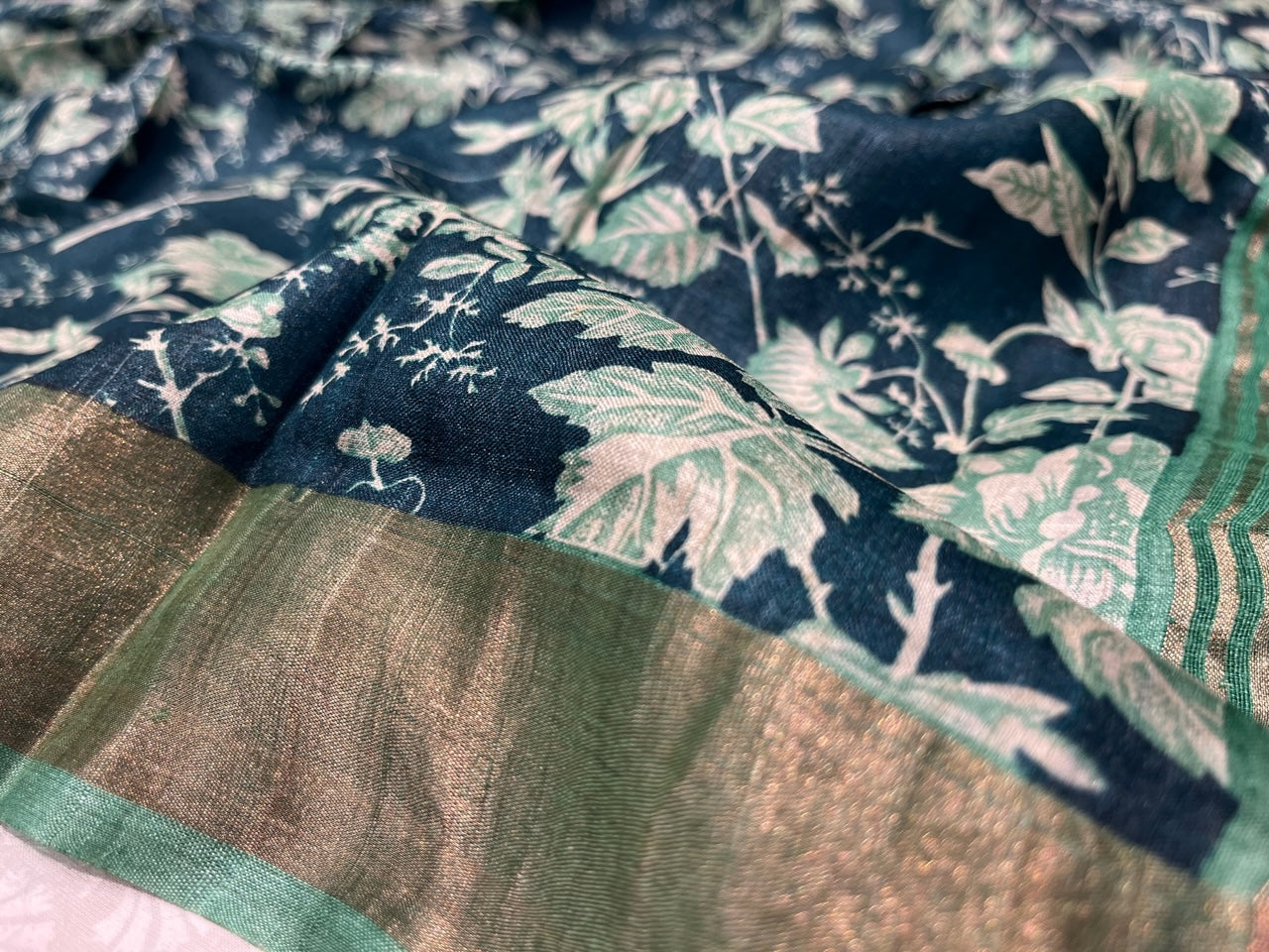 (DELIVERY IN 25 DAYS) PEACOCK BLUE COLOUR TUSSAR SILK PRINTED SAREE WITH ZARI BORDER