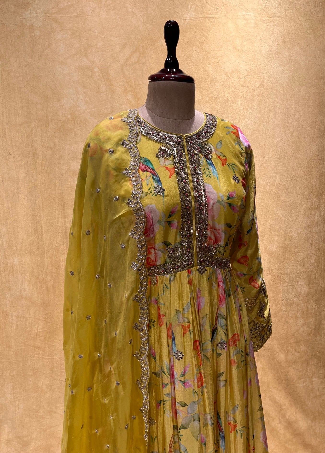 YELLOW COLOUR PRINTED CHINON FLOOR LENGTH SUIT WITH ORGANZA DUPATTA EMBELLISHED WITH ZARI EMBROIDERY