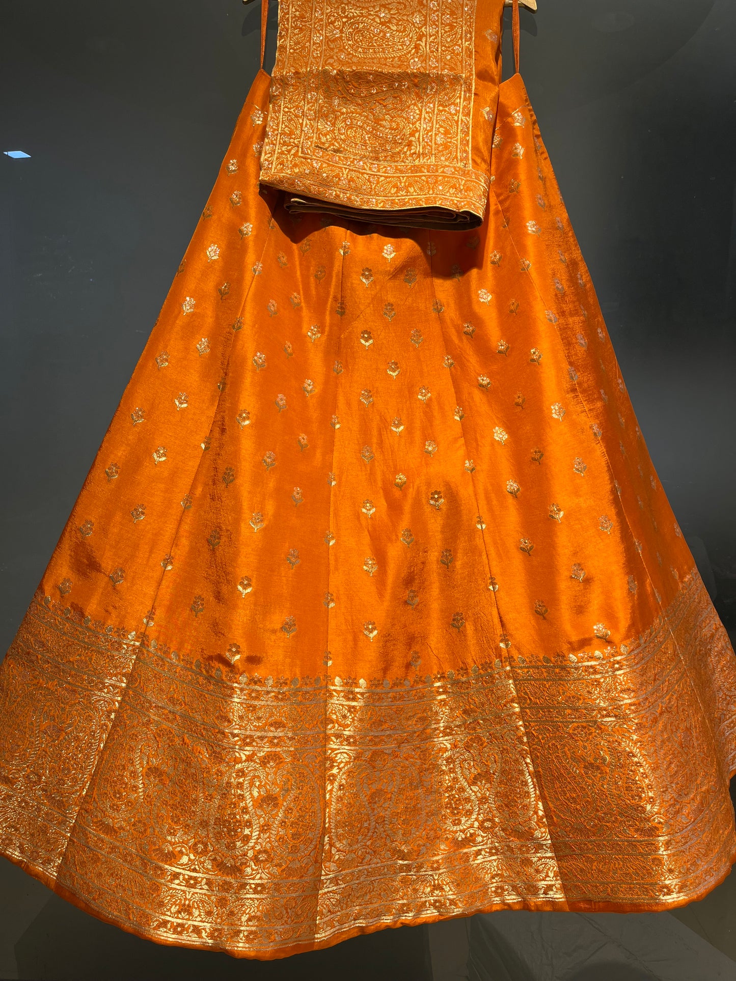 ( DELIVERY IN 25 DAYS ) ORANGE COLOUR BANARASI SILK LEHENGA EMBELLISHED WITH ZARI WEAVES
