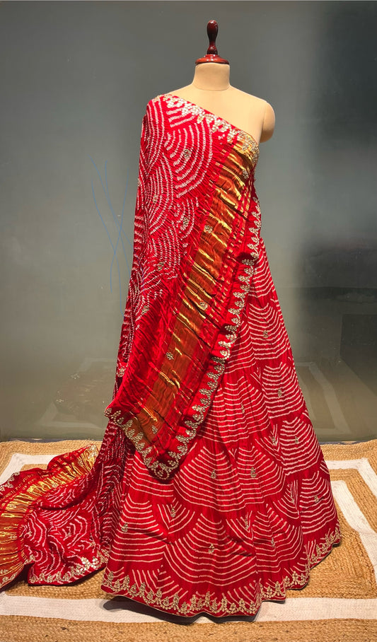 RED COLOUR PURE SATIN SILK BANDHEJ LEHENGA WITH UNSTITCHED BLOUSE EMBELLISHED WITH GOTA PATTI & ZARDOZI WORK