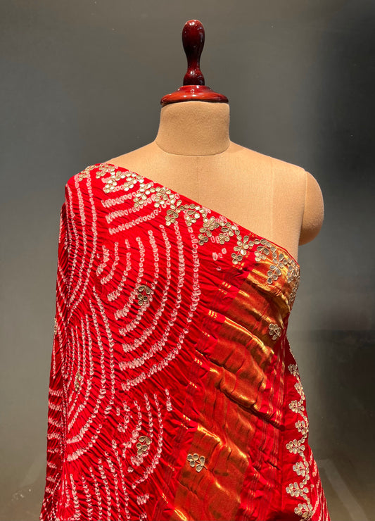 (Deliver in 30 Days) RED COLOUR PURE SATIN SILK BANDHEJ LEHENGA WITH UNSTITCHED BLOUSE EMBELLISHED WITH GOTA PATTI & ZARDOZI WORK