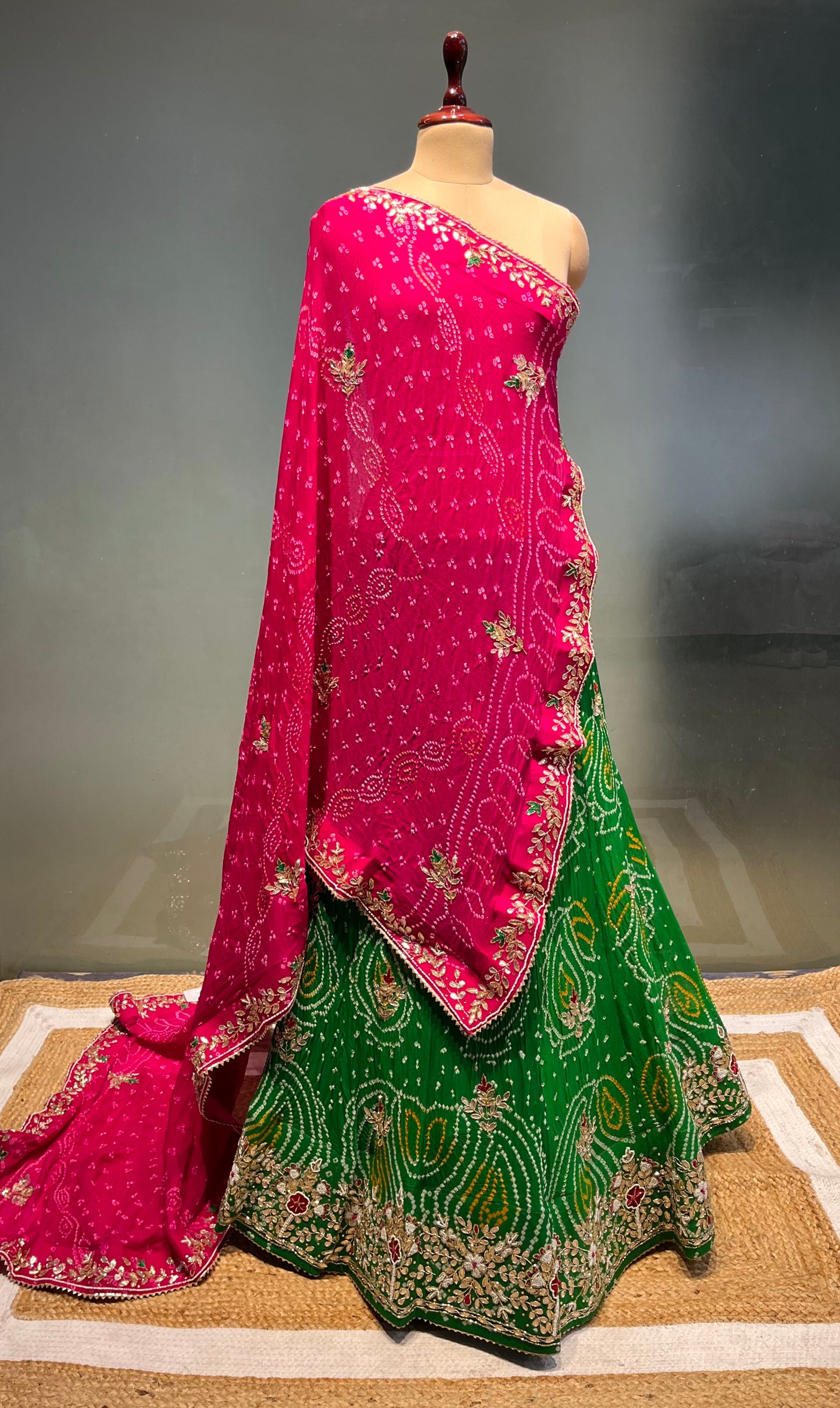 ( DELIVERY IN 20-25 DAYS ) GREEN COLOUR PURE OJARIYA BANDHEJ LEHENGA WITH UNSTITCHED BLOUSE EMBELLISHED WITH CUTDANA, GOTA PATTI & ZARDOZI WORK
