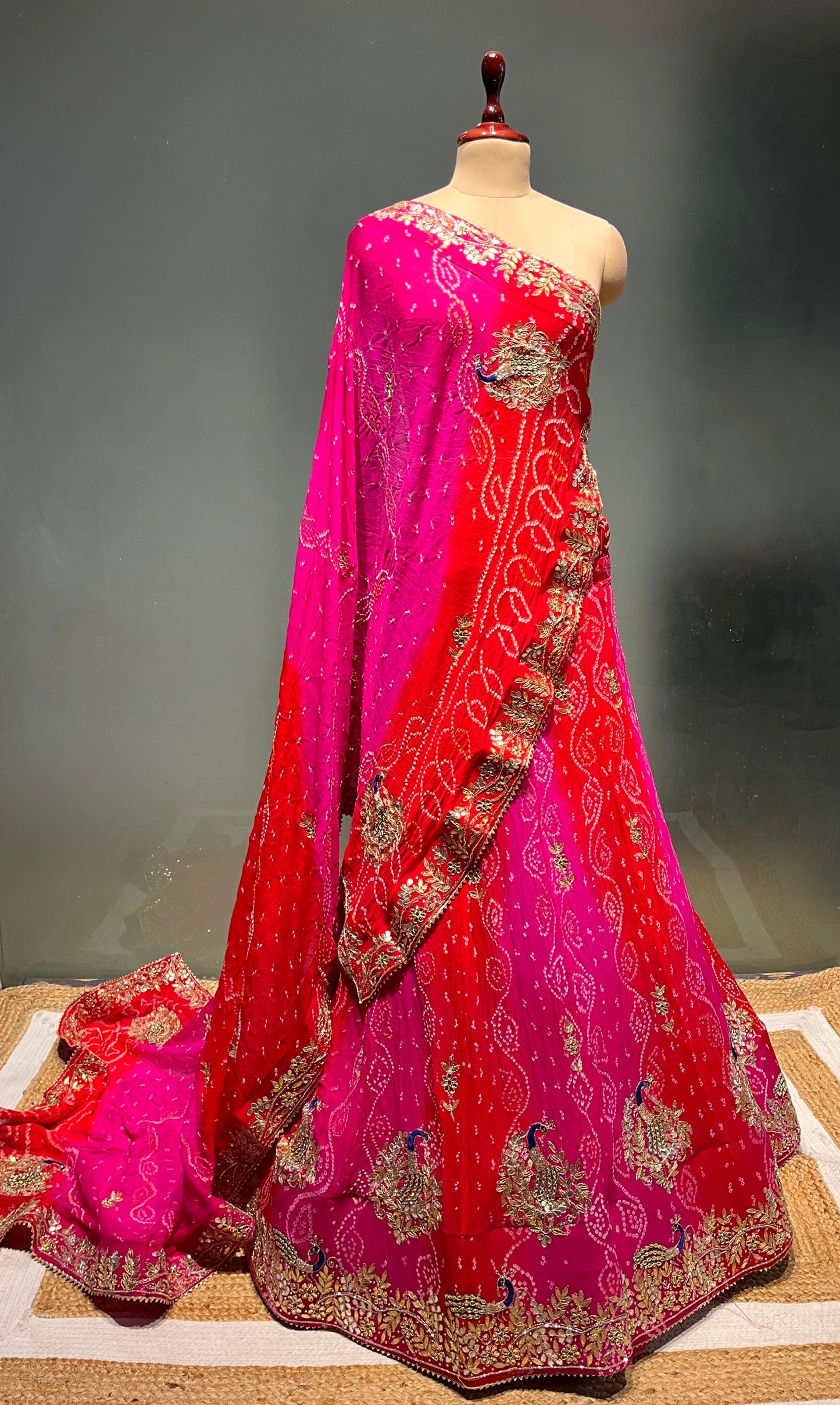 ( DELIVERY IN 20-25 DAYS ) ORANGE & PINK COLOUR PURE OJARIYA BANDHEJ LEHENGA WITH UNSTITCHED BLOUSE EMBELLISHED WITH GOTA PATTI, CUTDANA & ZARDOZI WORK