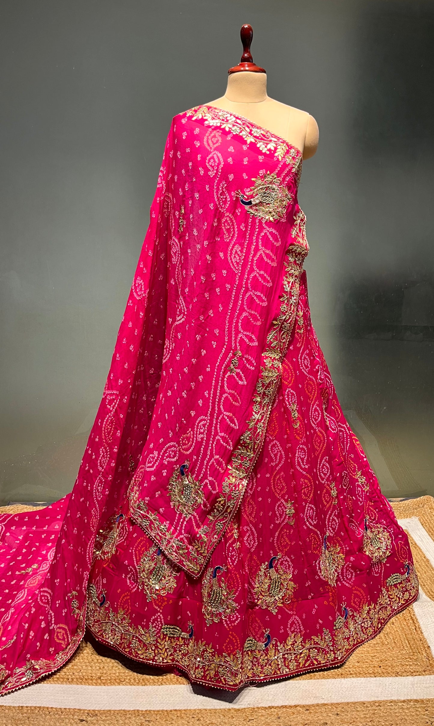 PINK COLOUR PURE OJARIYA BANDHEJ LEHENGA WITH UNSTITCHED BLOUSE EMBELLISHED WITH CUTDANA, GOTA PATTI & ZARDOZI WORK