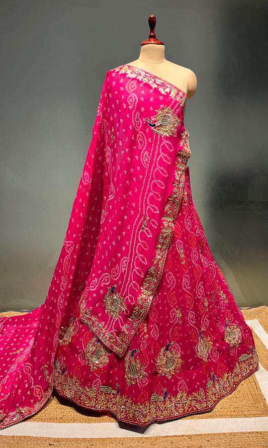 PINK COLOUR PURE OJARIYA BANDHEJ LEHENGA WITH UNSTITCHED BLOUSE EMBELLISHED WITH CUTDANA, GOTA PATTI & ZARDOZI WORK